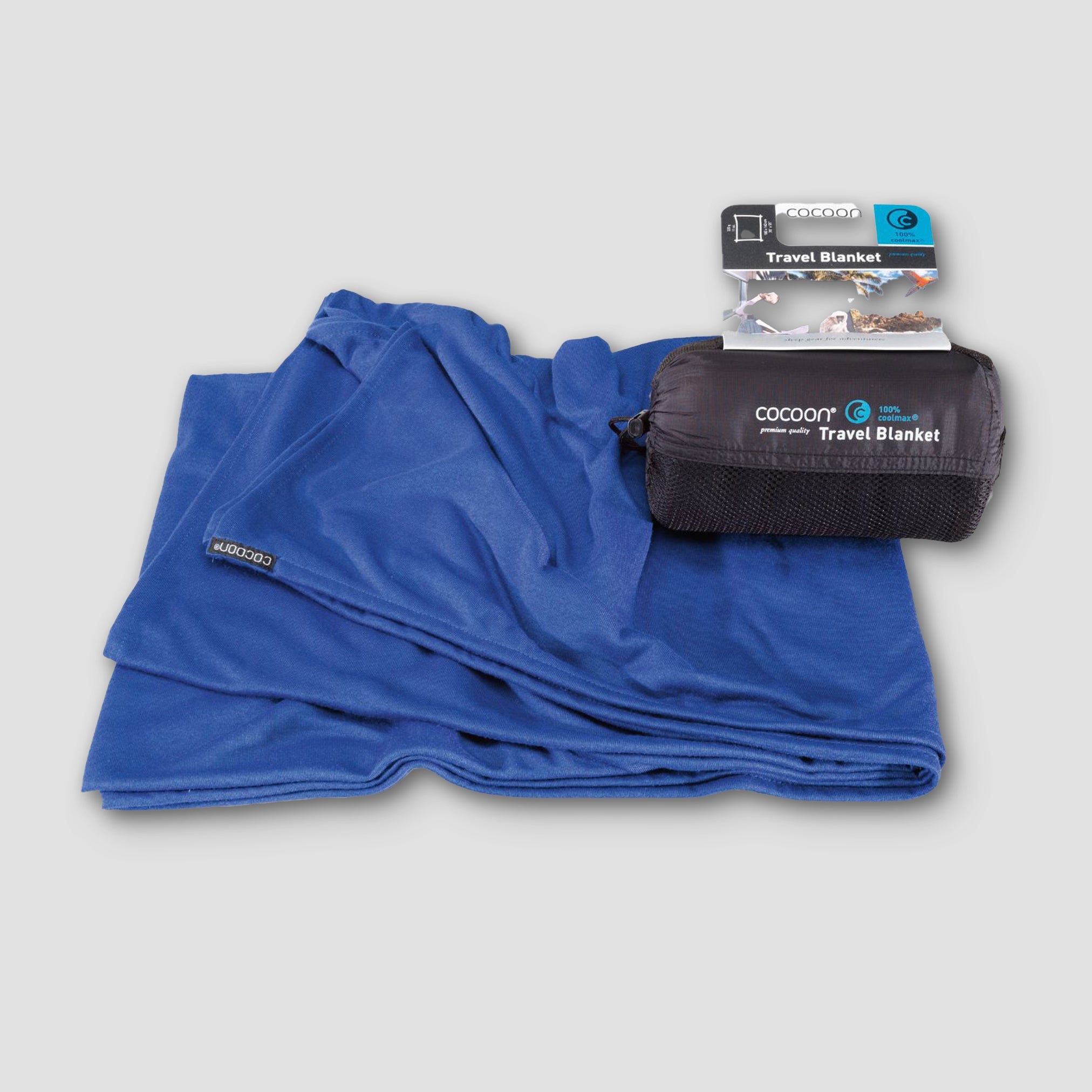 COCOON COOLMAX® travel blanket in a compact, folded design, showcasing soft fabric suitable for travel and outdoor use.