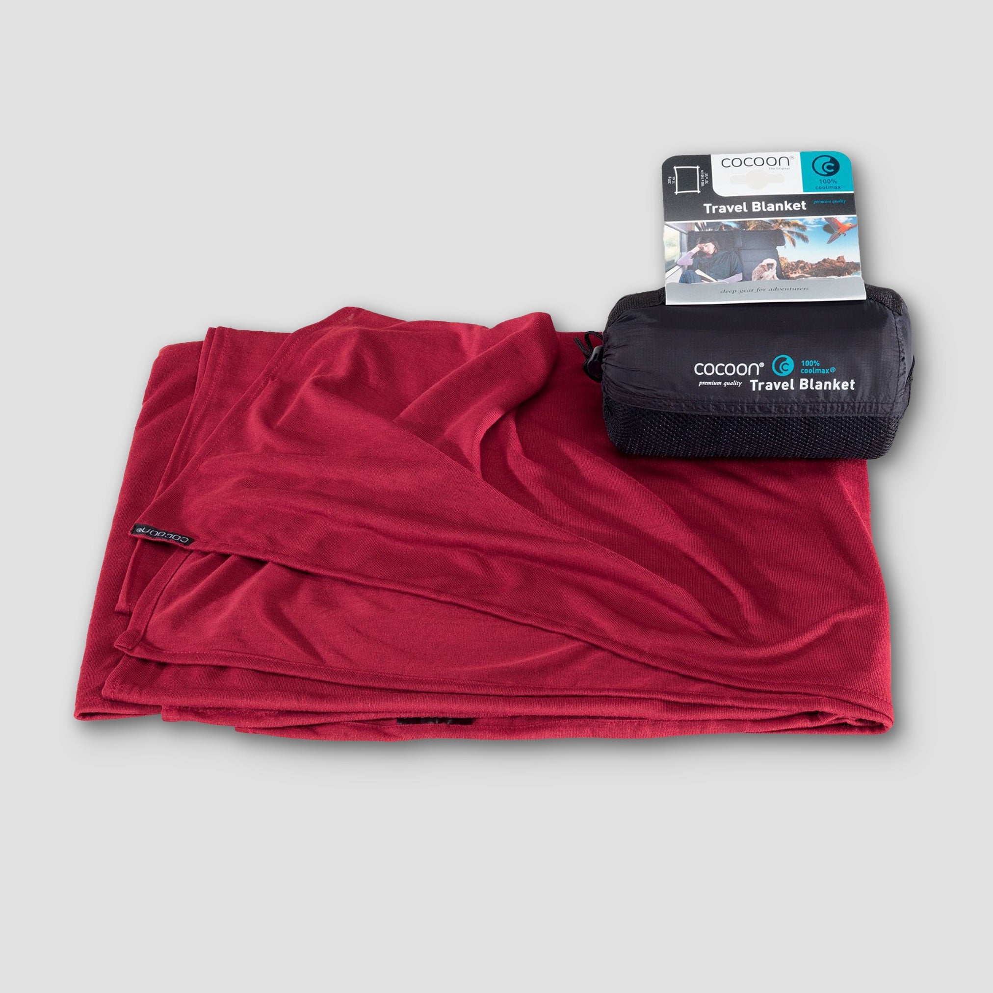 COCOON COOLMAX® travel blanket folded neatly, showcasing its lightweight fabric and compact design for easy portability.
