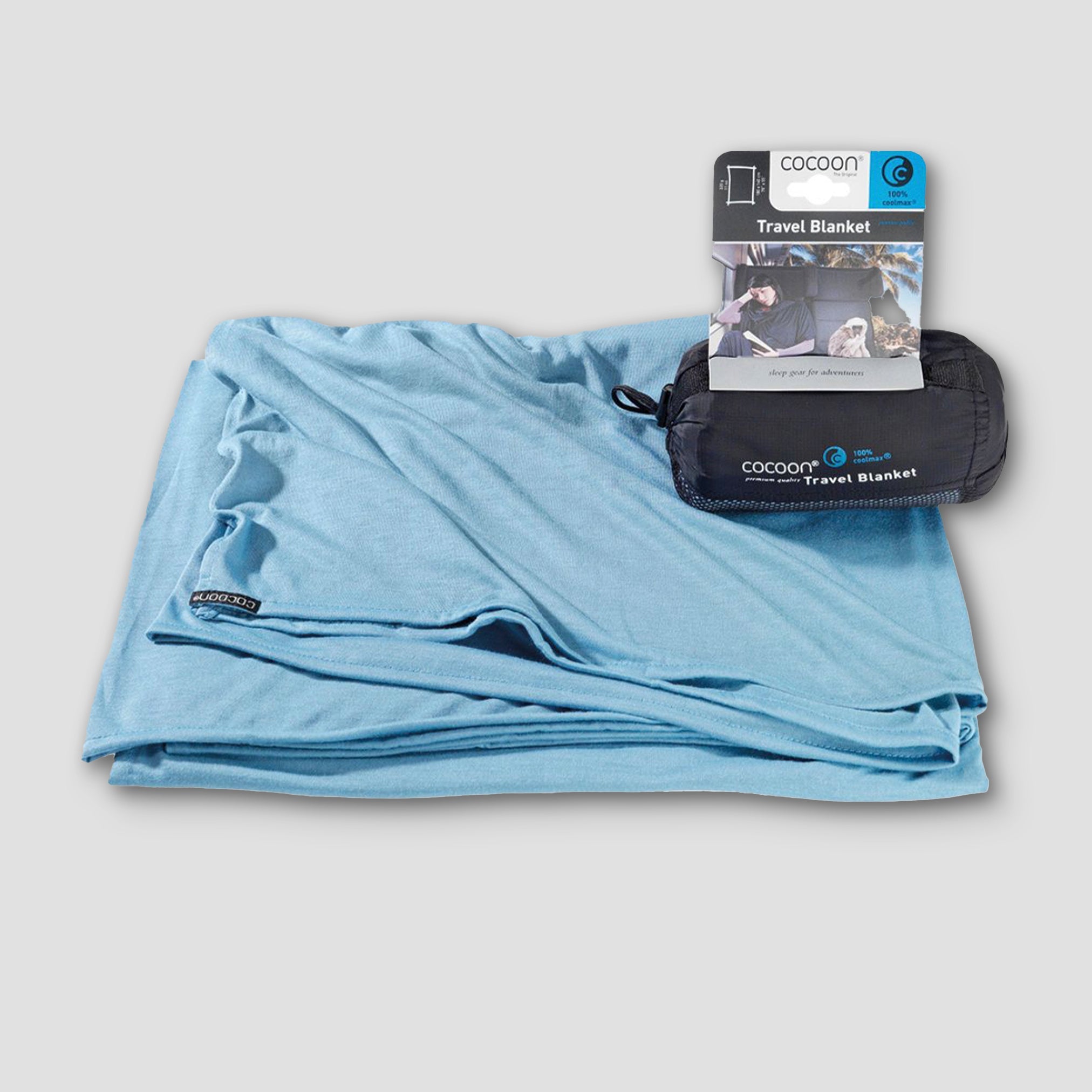 COCOON COOLMAX® travel blanket in soft fabric, ideal for comfort on the go, displayed in a folded position.