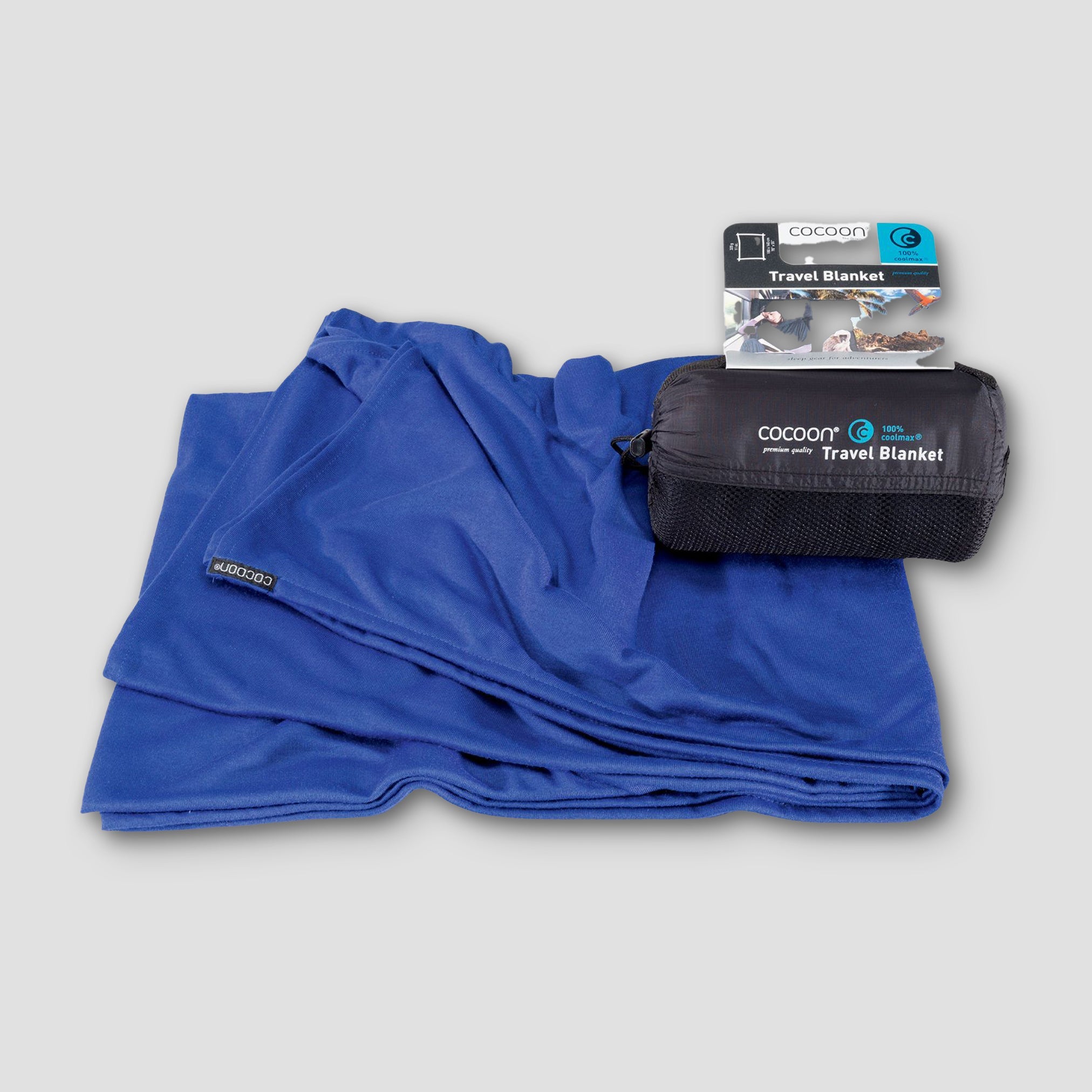 COCOON COOLMAX® travel blanket in a compact design, showcasing soft fabric and portable features for on-the-go comfort.