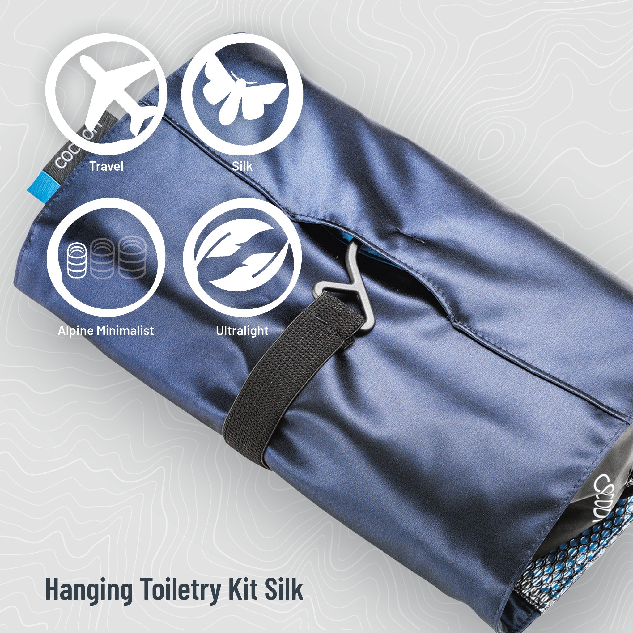 Minimalist hanging toiletry kit by COCOON made of Monsoon Silk™ with multiple compartments for travel organization.