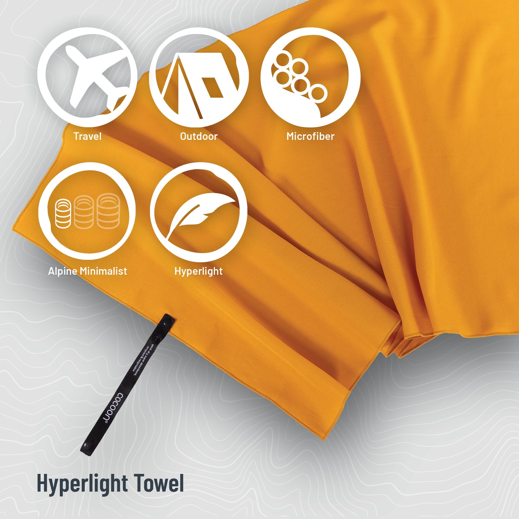 COCOON Hyperlight Travel Towel displayed in vibrant colors, showcasing its lightweight and compact design for travel.