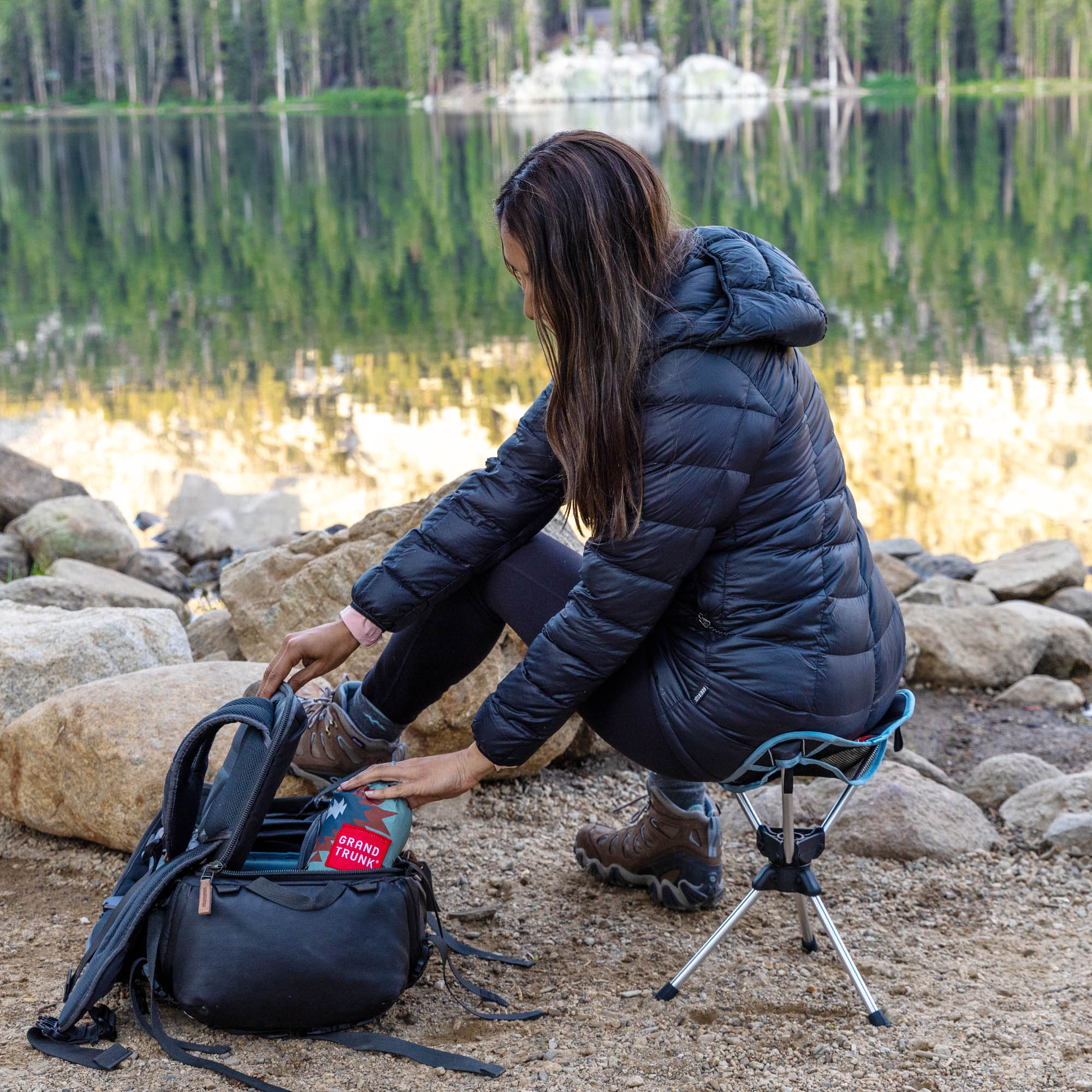 GrandTrunk Compass 360° swivel stool in outdoor setting, featuring sturdy design and comfortable seating for recreation.
