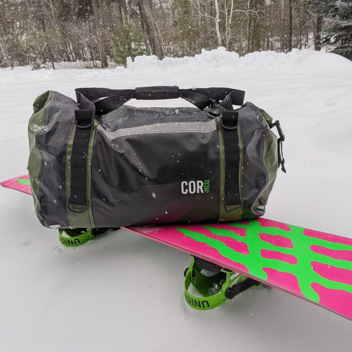 COR Surf waterproof roll-top dry duffel bag in 60L size, made from durable waterproof material, with adjustable shoulder strap.
