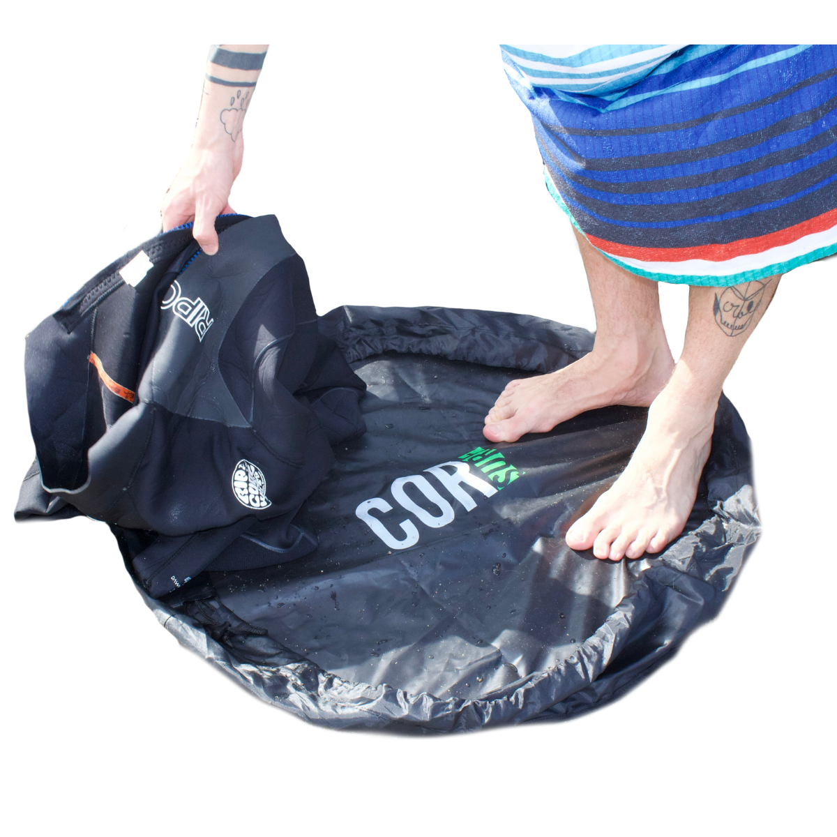 COR Surf Surfer Bundle with a poncho, surf rack, change mat, and wax, featuring accessories for surfers' convenience.