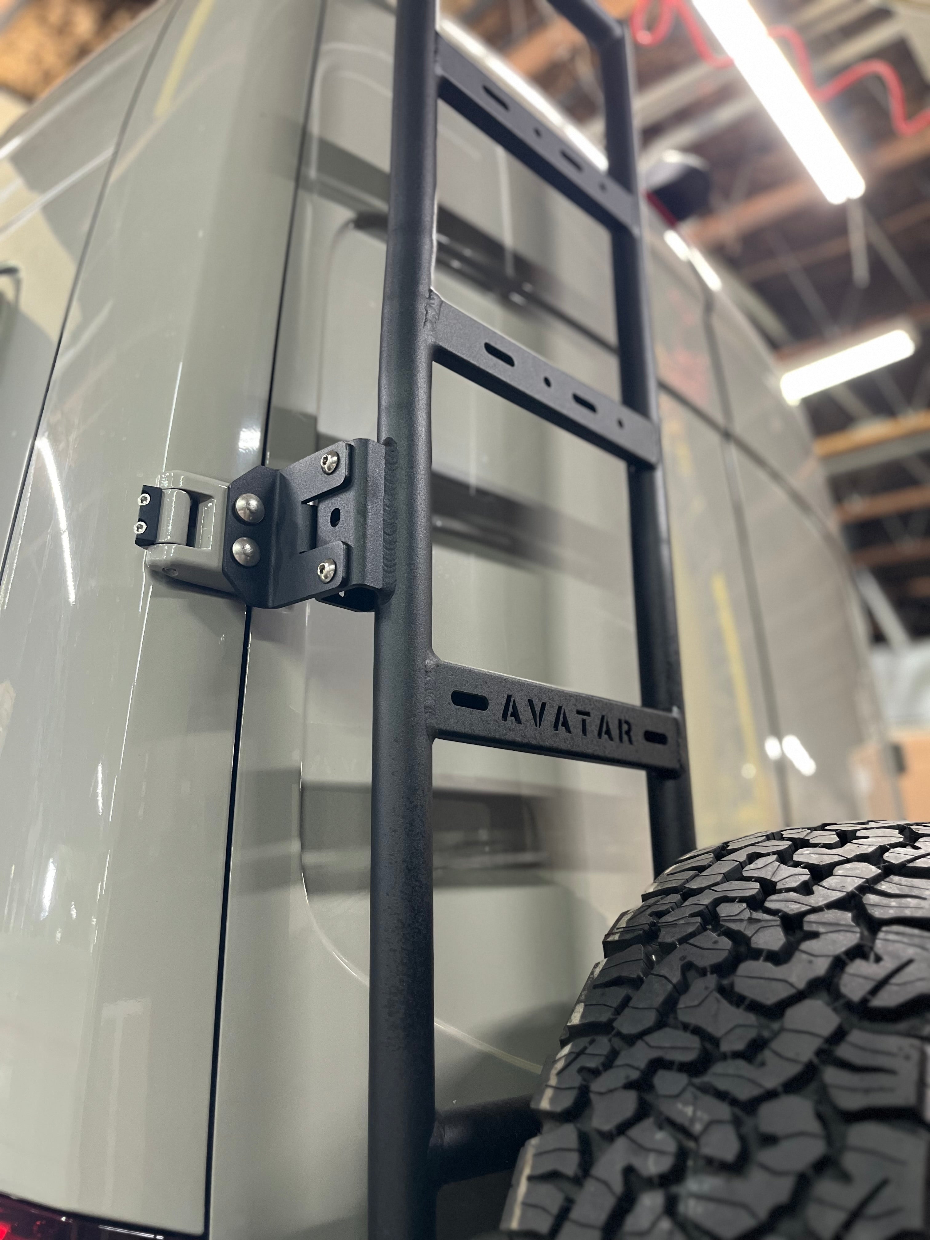 Avatar Offroad rear ladder tire carrier mount attached to vehicle, featuring a sturdy custom ladder for easy tire access.