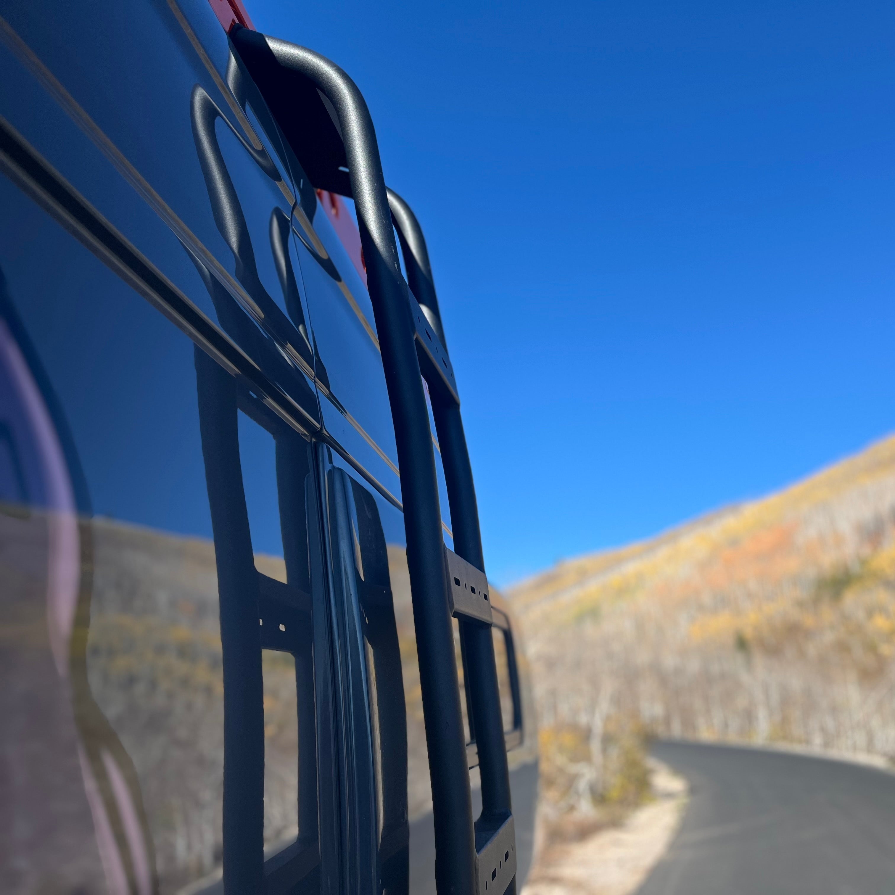 Mercedes Sprinter Van side ladder by Avatar Offroad, custom off-road ladder mounted on van side for easy roof access.