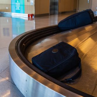 Backcountry Sportsman Convertible Jet-Setter travel bag with multiple compartments, shown in a sleek black design.