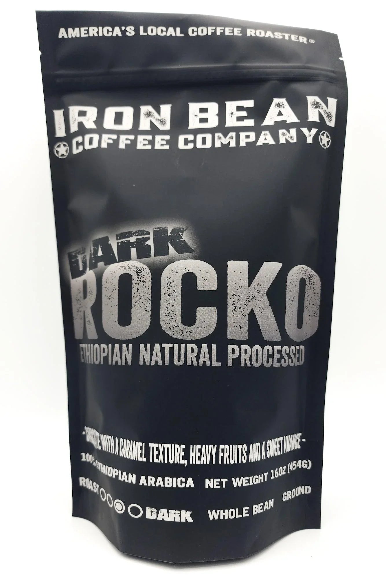 Ethiopian natural process coffee beans in a darker roast from Iron Bean Coffee Company, showcasing rich color and texture.