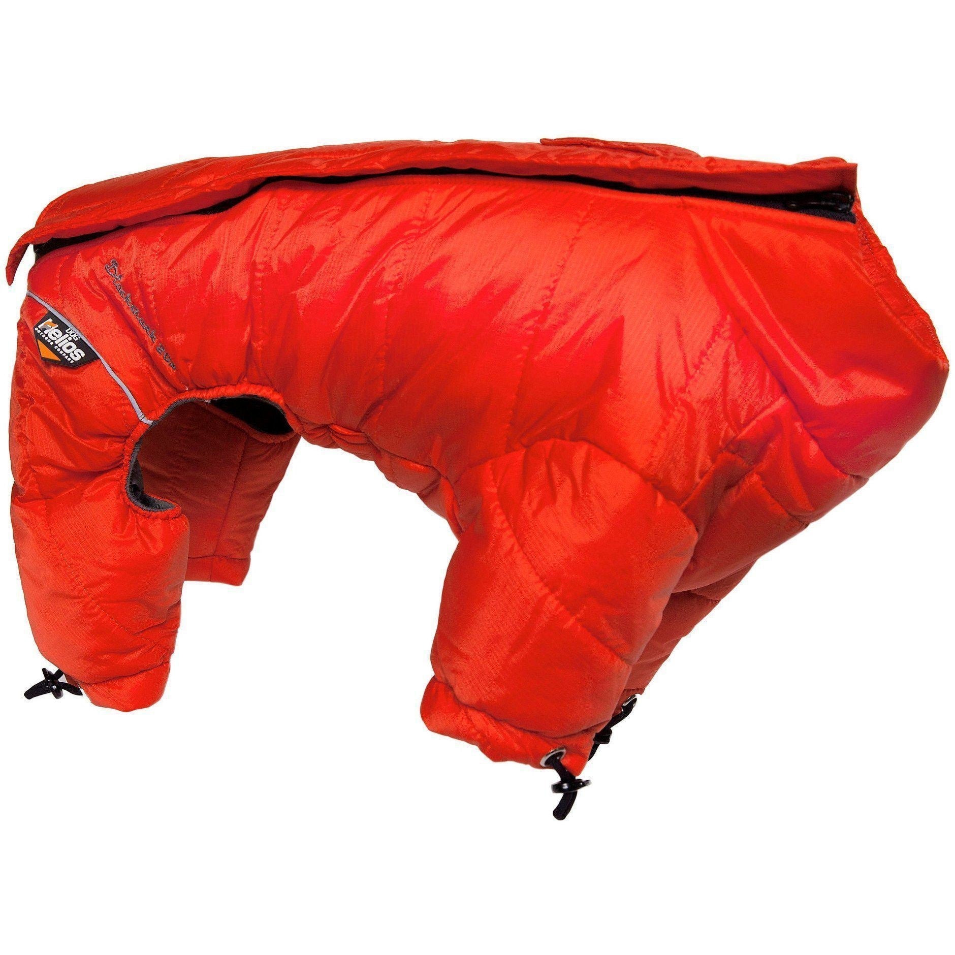 Dog wearing Pet Life Helios Thunder-crackle adjustable reflective full-body winter jacket in a snowy setting.