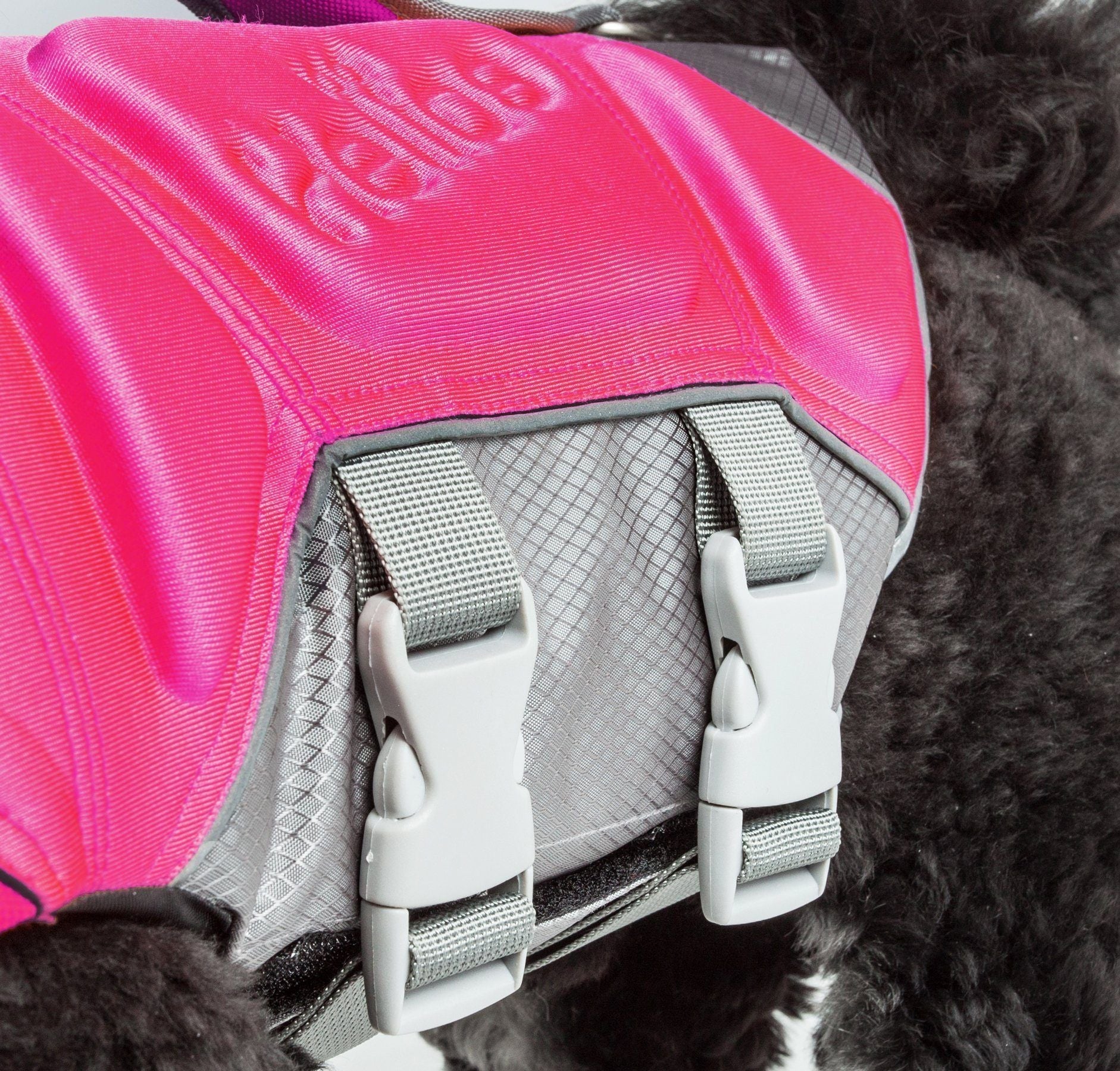 Reflective Pet Life dog life jacket vest with multi-point stitching, designed for safety during water activities.