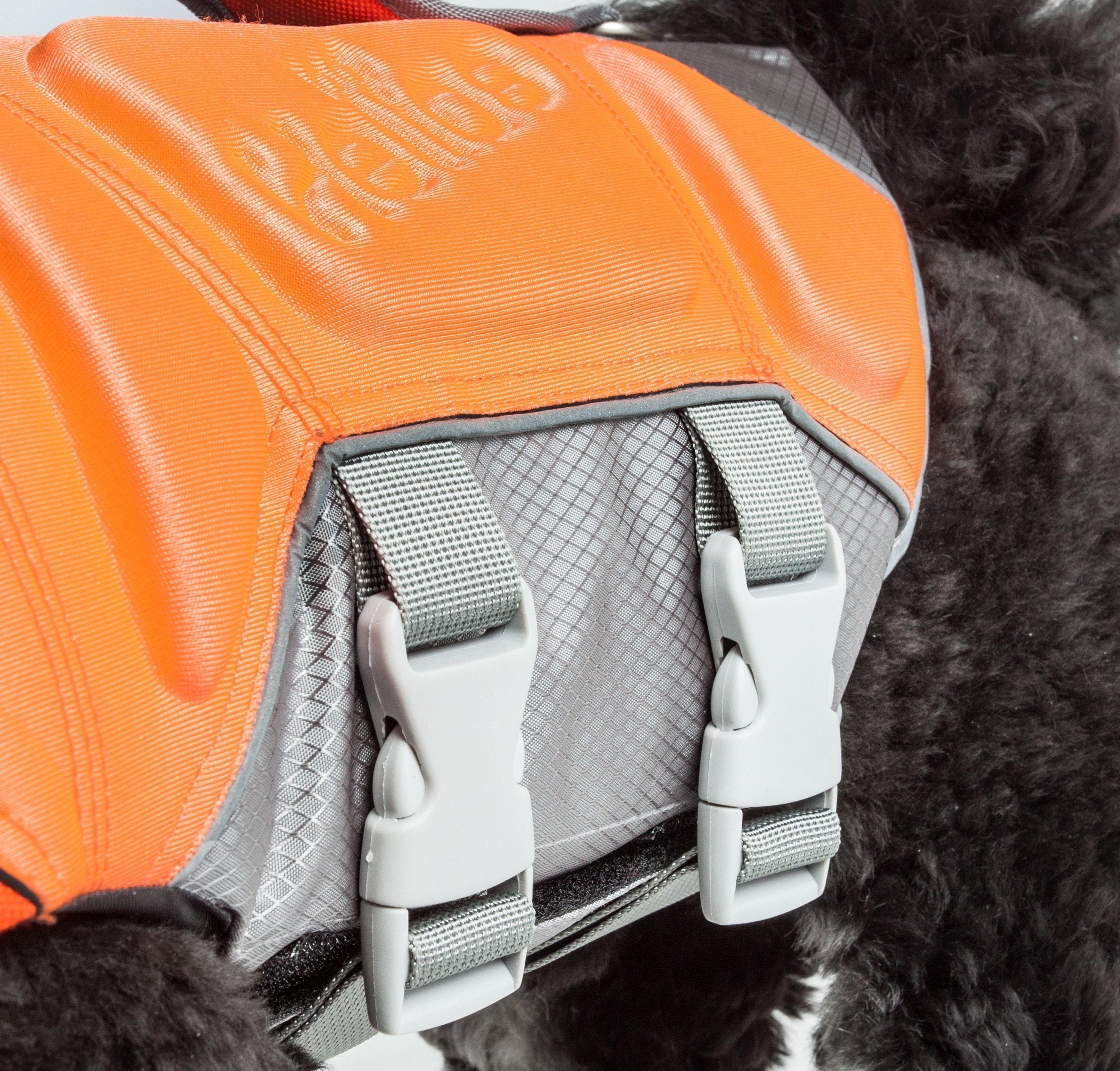 Reflective Pet Life dog life jacket vest with multi-point stitching, designed for safety and buoyancy in water.