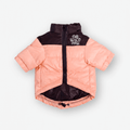 Pink Highlander insulated puffer jacket for dogs by The Wild Paw, featuring an integrated logo and cozy, weather-resistant design.