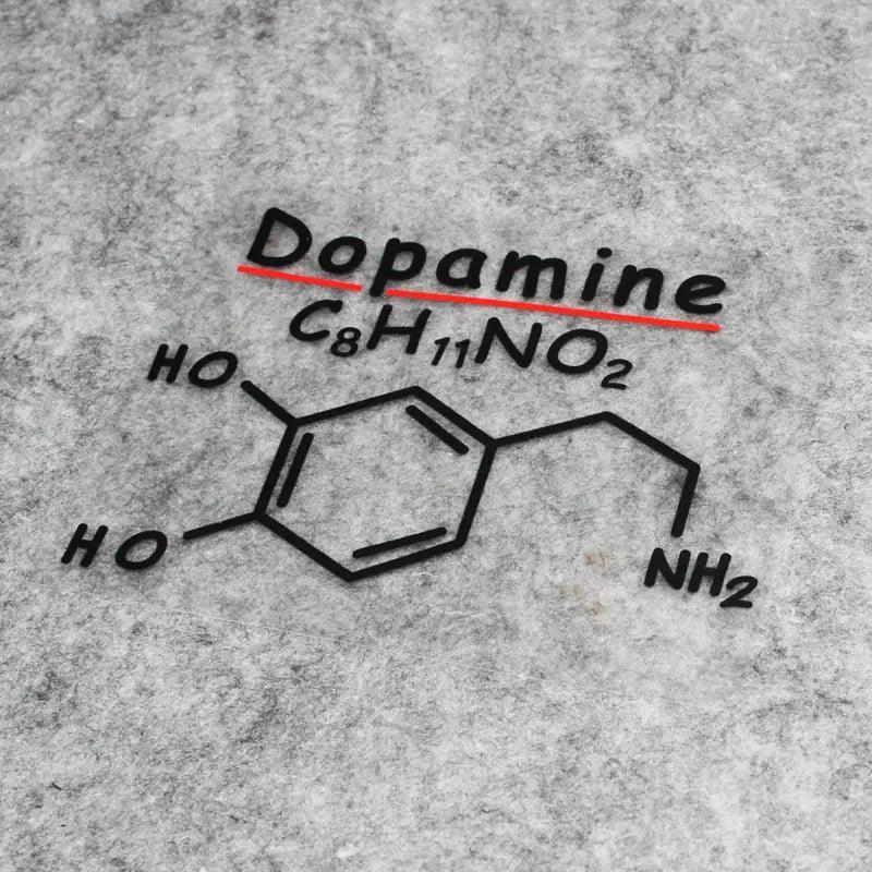 Decorative stickers featuring chemical formulas of dopamine, adrenaline, and caffeine from Bean's Moto Booth.