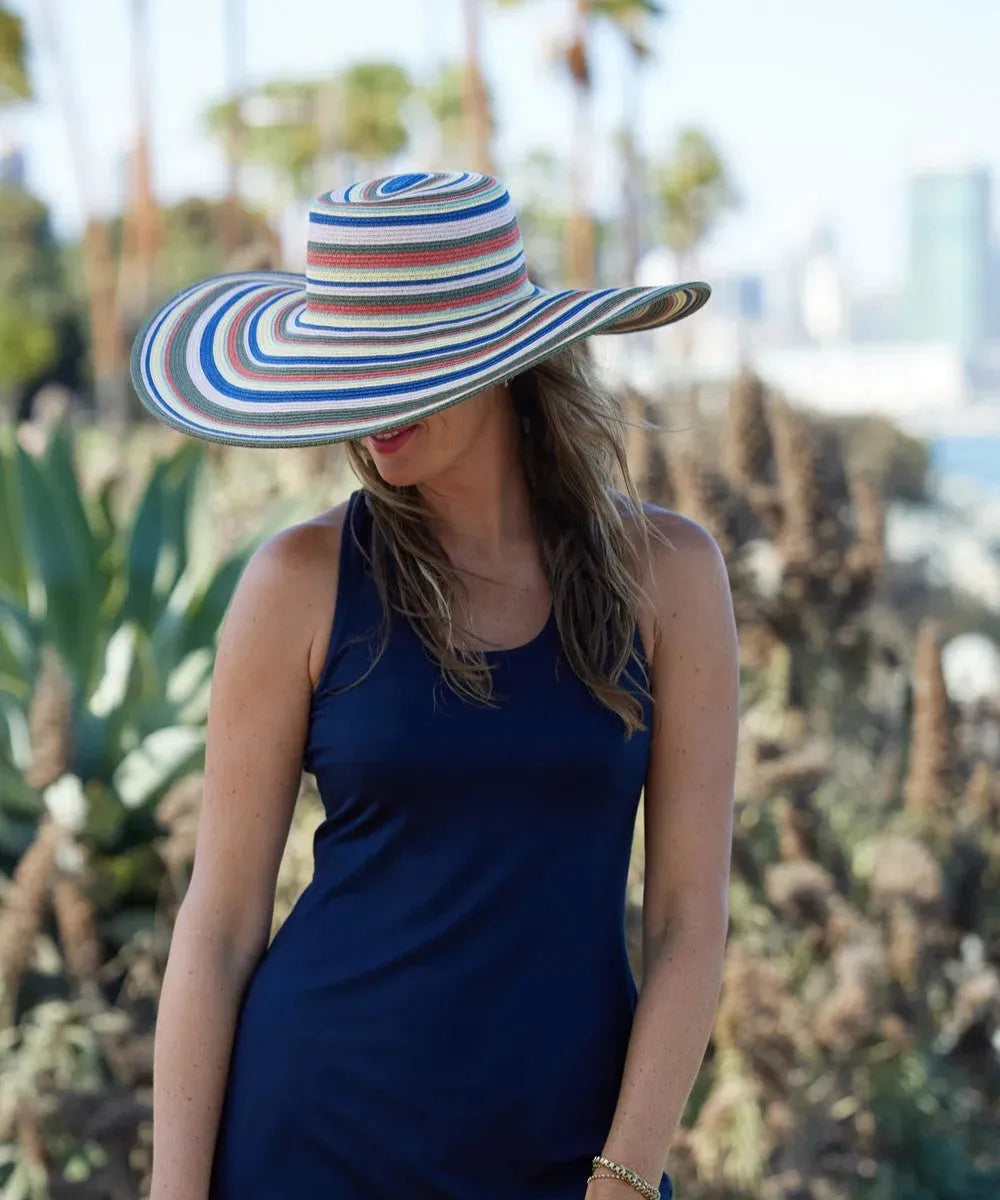 Women's wide brim straw sun hat by Peter Grimm Drew, stylish headwear with a natural straw finish for sun protection.