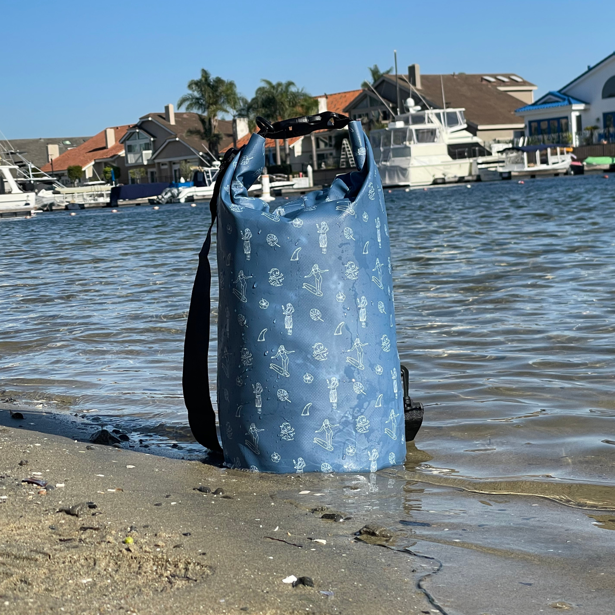 COR Surf Hawaiian Print 5L dry bag for accessories, perfect for keeping belongings dry during outdoor adventures.