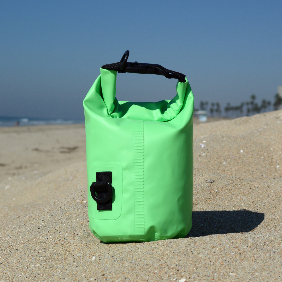 COR Surf dry bag in black, showing the waterproof back with adjustable strap and roll-top closure, available in 3L to 15L sizes.