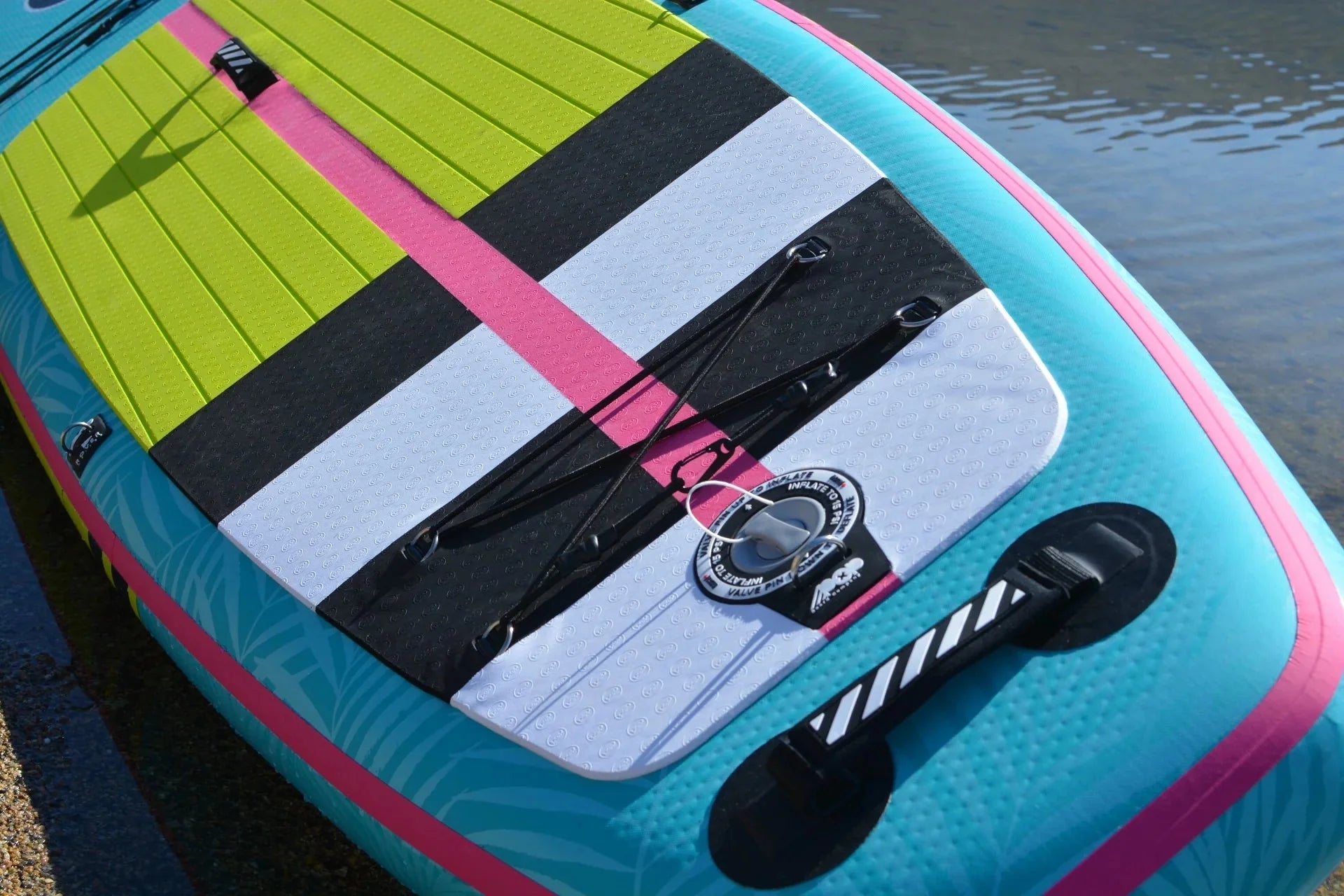 Backcountry Sportsman 11'0 Yacht Hopper paddleboard in mint, teak, and blue with a sleek, durable design on a calm water background.