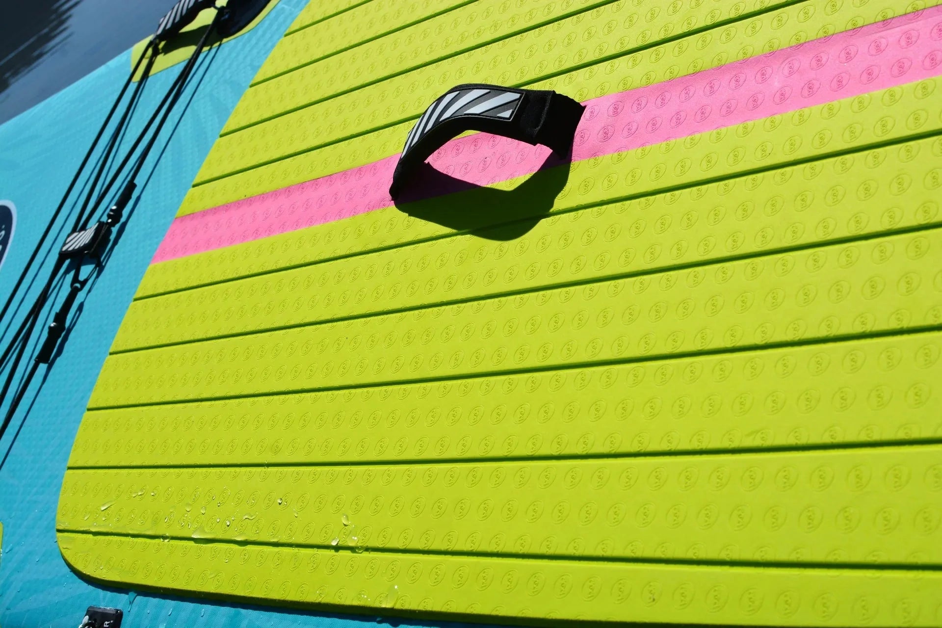 Backcountry Sportsman 11'0 Yacht Hopper inflatable with mint, teak, and blue colors, featuring a sleek boat design on water.
