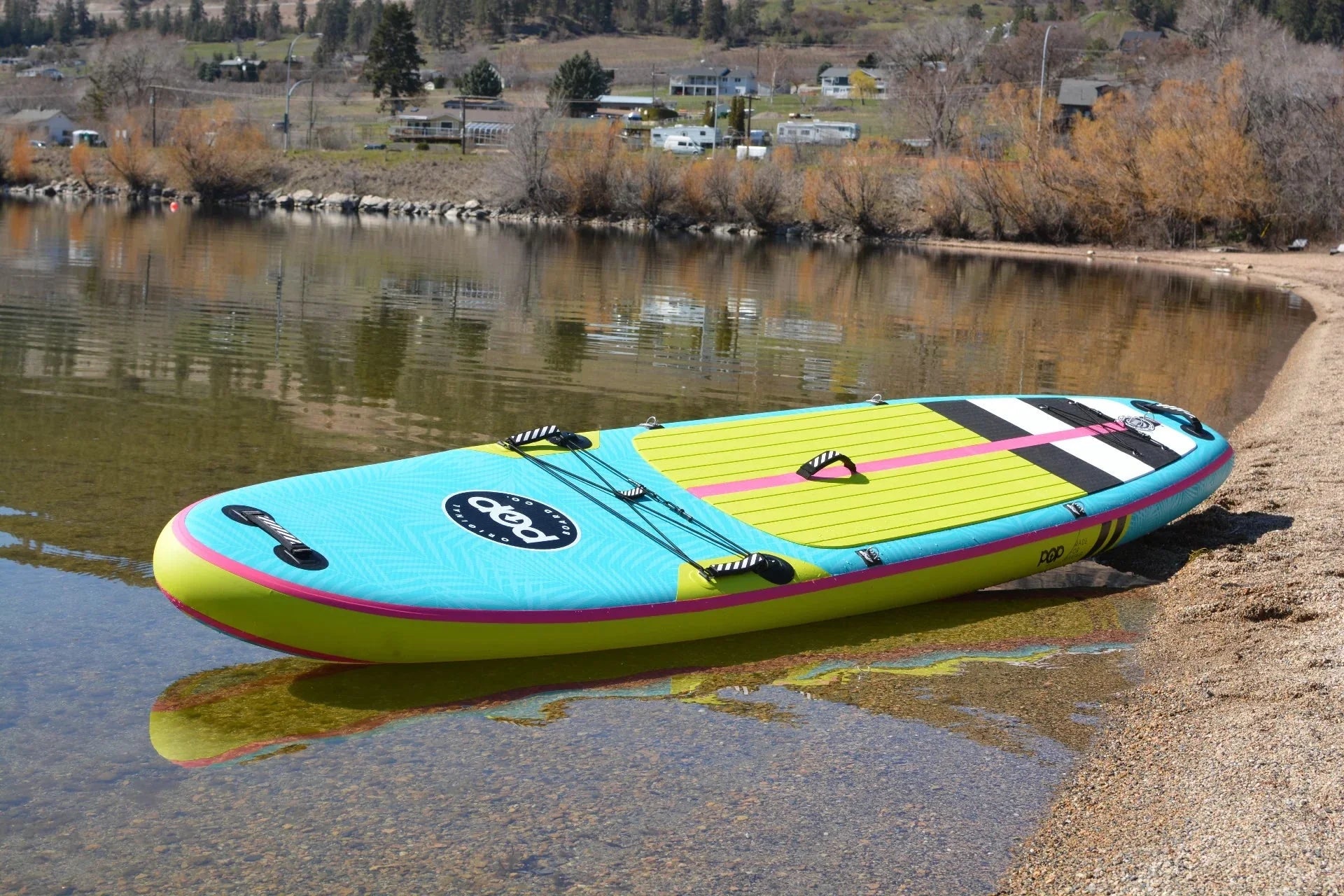 Backcountry Sportsman 11'0 Yacht Hopper paddleboard with mint, teak, and blue design, showcasing its sleek deck and vibrant colors.