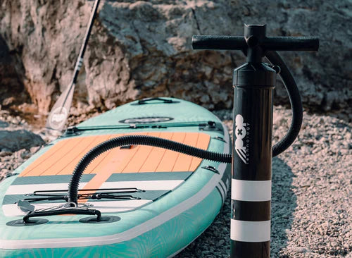 Backcountry Sportsman 11'0 Yacht Hopper paddleboard in mint, teak, and blue with a textured deck and sleek design.