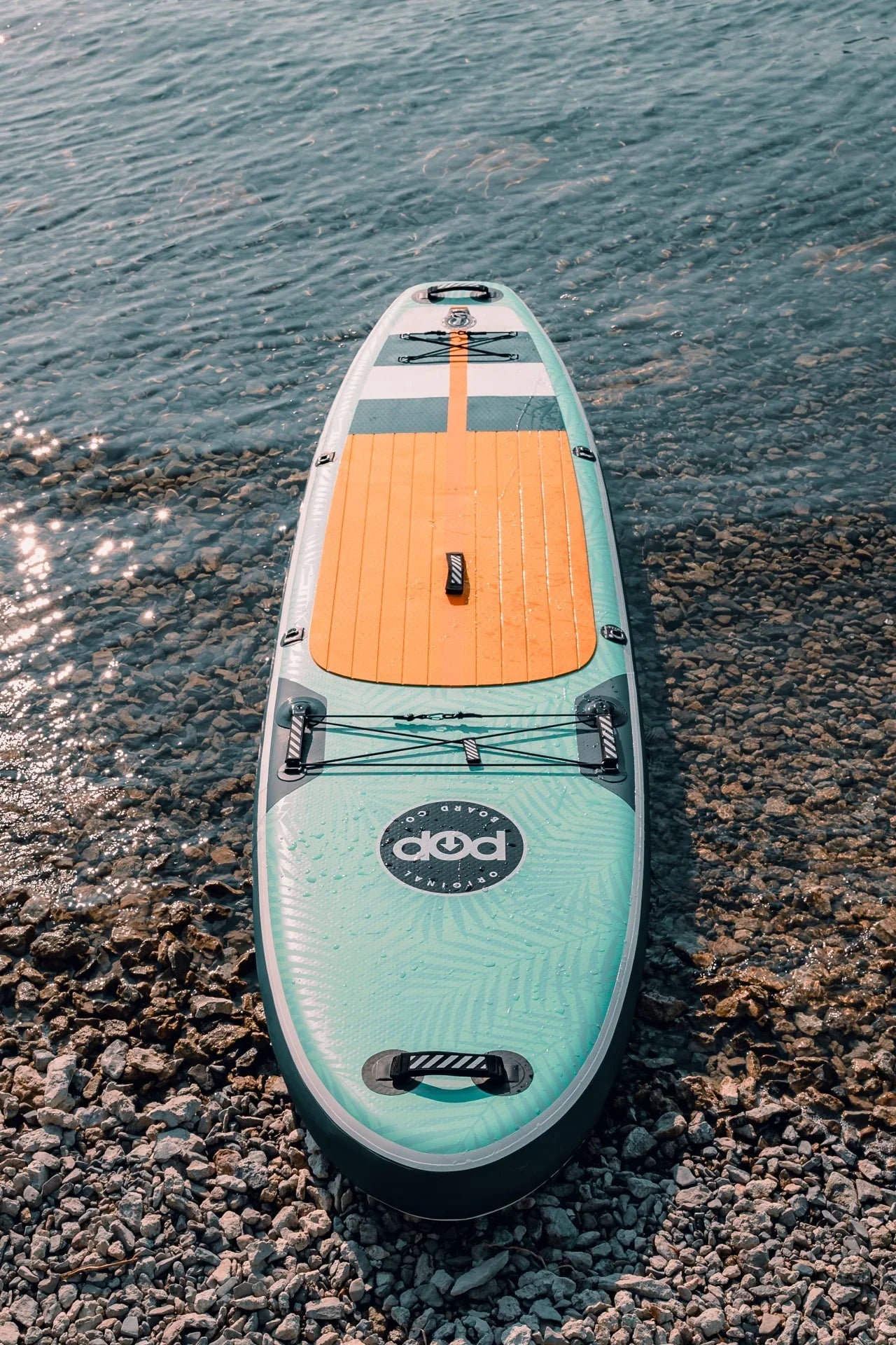 Backcountry Sportsman 11'0 Yacht Hopper paddleboard with mint, teak, and blue design, showing the deck and colorful accents.