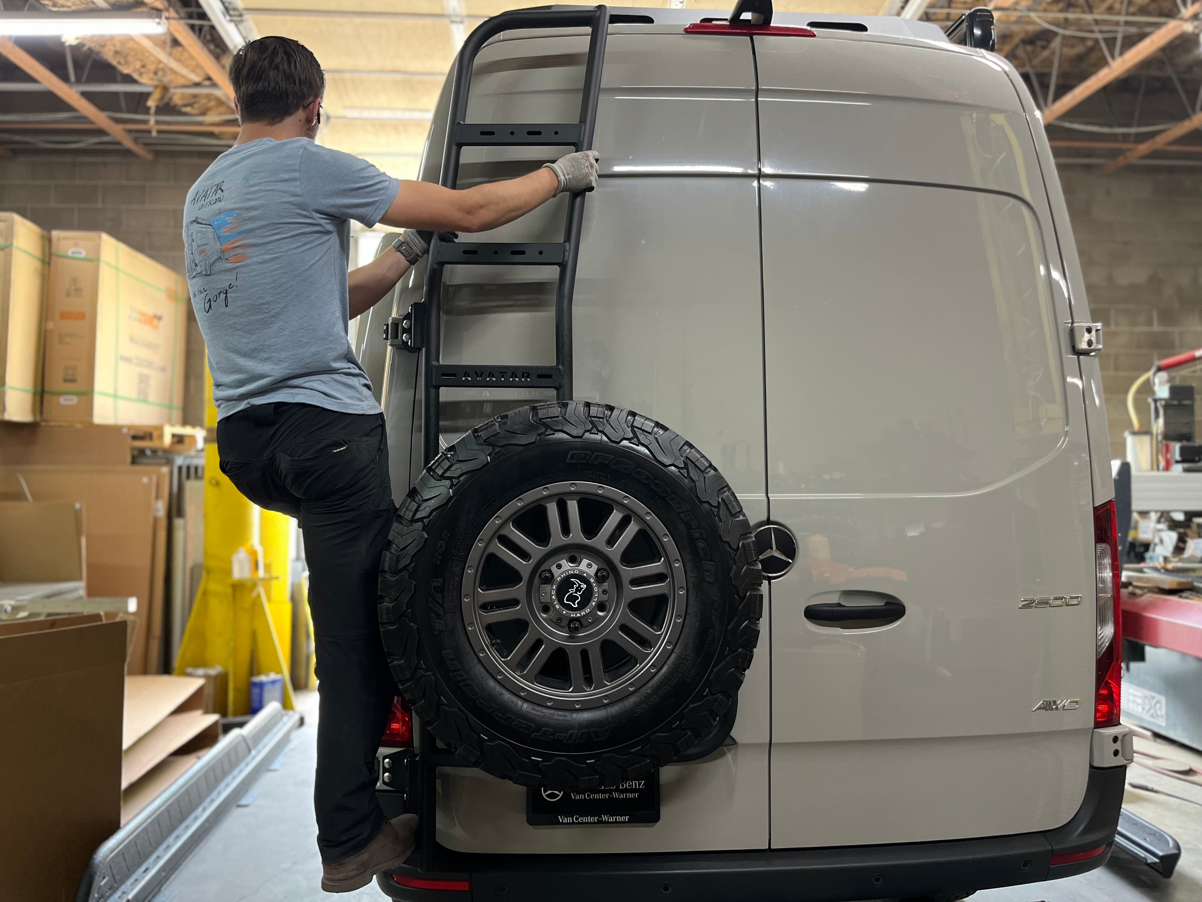 Durable Avatar Offroad rear ladder tire carrier mount attached to vehicle, holding a spare tire for off-road adventures.