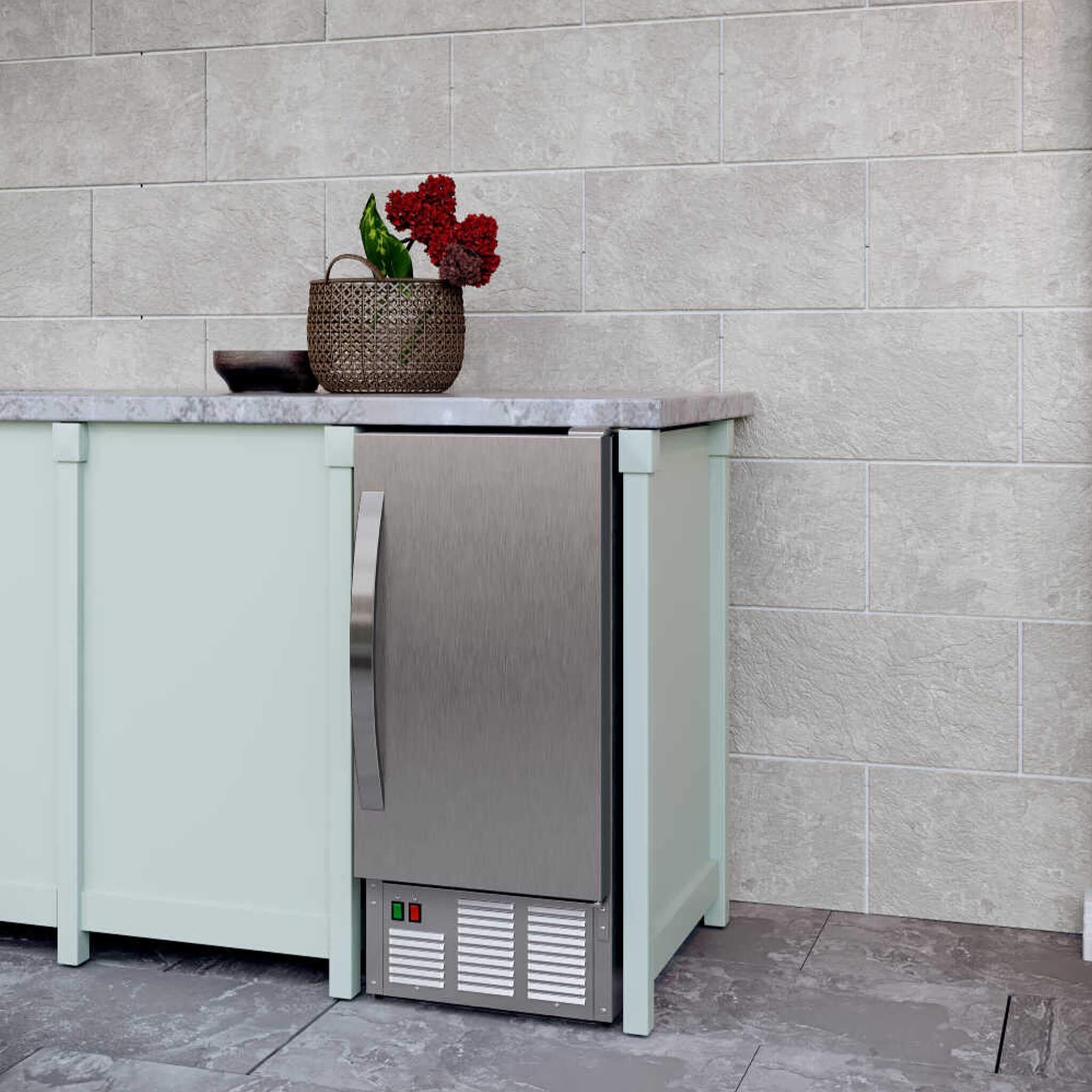Edgestar 15-inch outdoor undercounter ice maker with stainless steel finish and ice production feature in demonstration view.