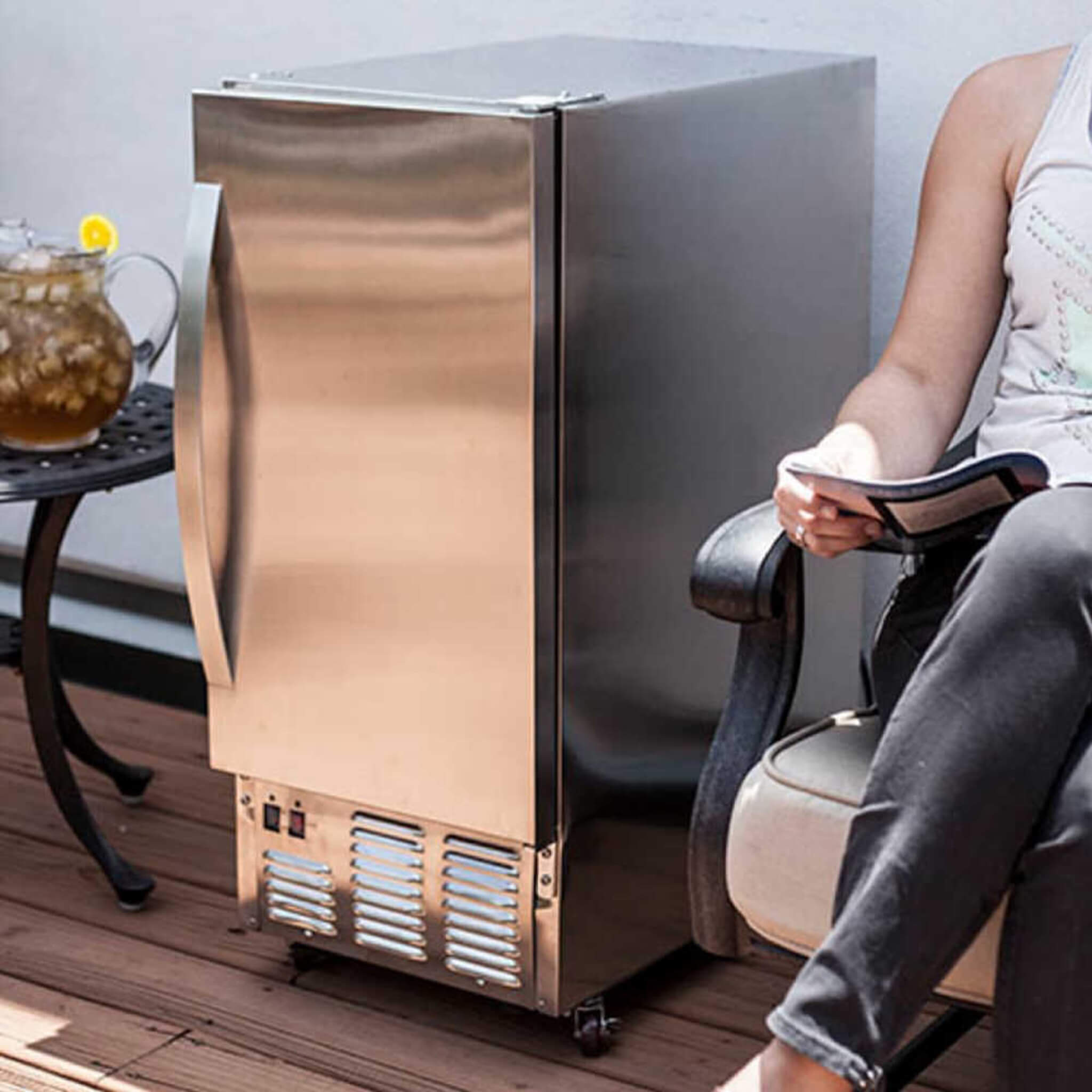 Edgestar 15-inch outdoor undercounter ice maker producing ice, showcasing stainless steel design and functional features.