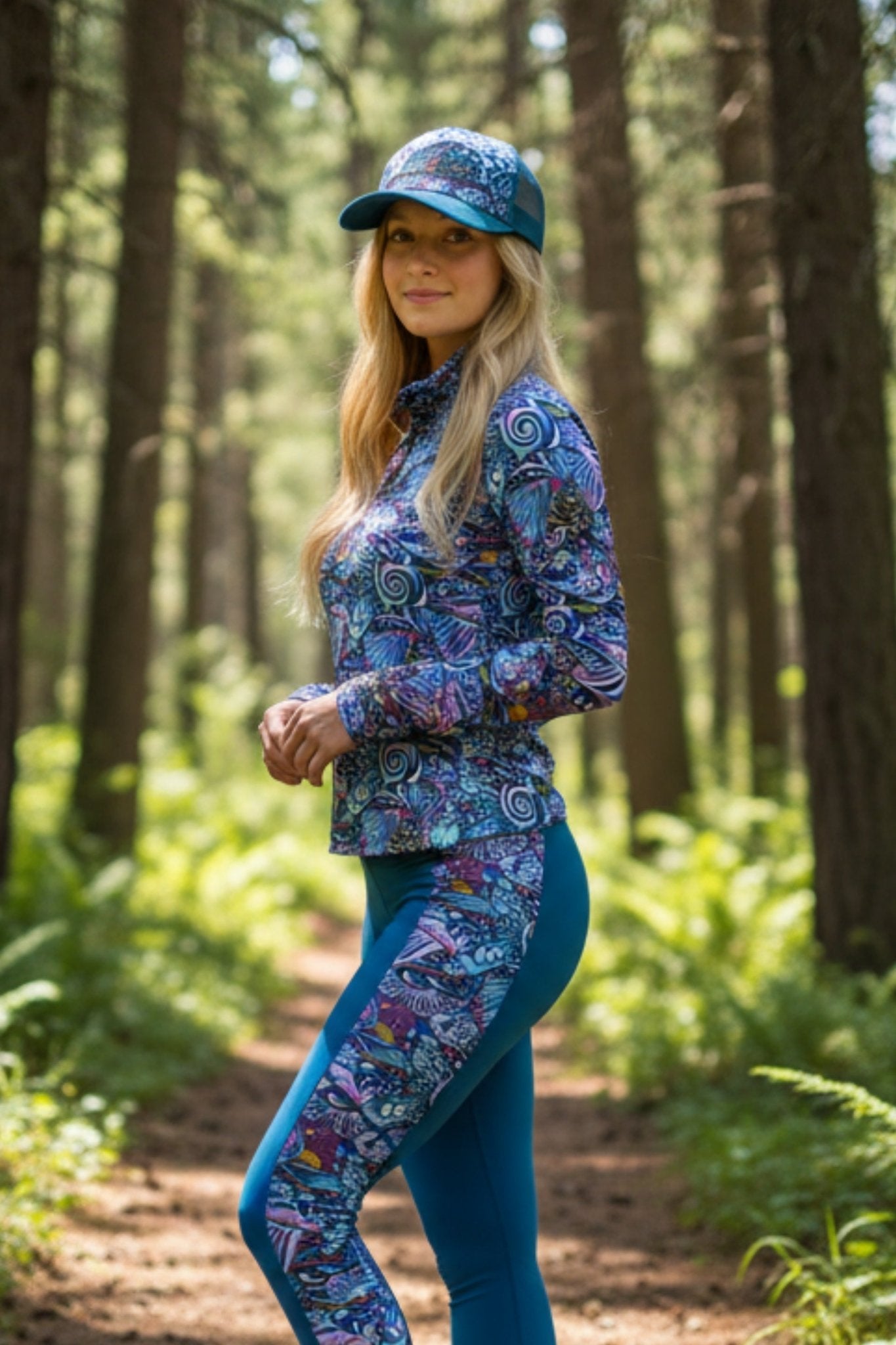 Gray trucker hat with abstract Enchanted Grayling design by FisheWear, featuring mesh back and curved brim.