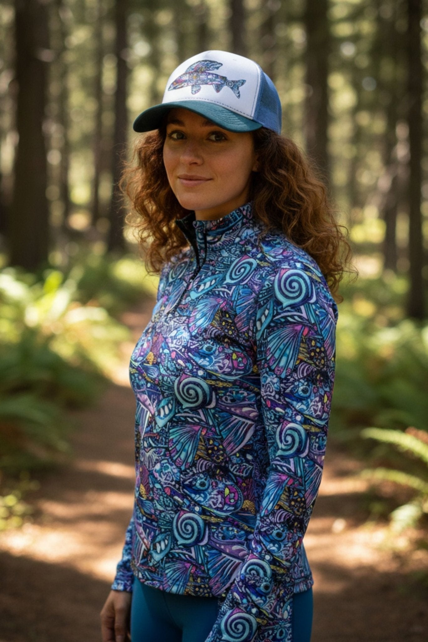 FisheWear Enchanted Grayling Trucker Hat featuring a gray fabric and mesh back, with a stylish embroidered fish design on the front.