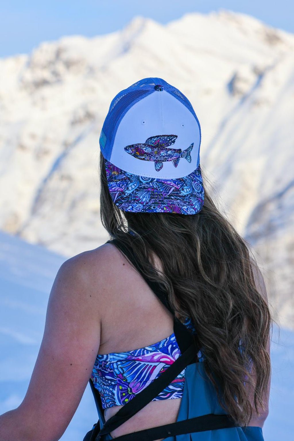 Gray Enchanted Grayling Trucker Hat by FisheWear featuring mesh back and embroidered fish design.