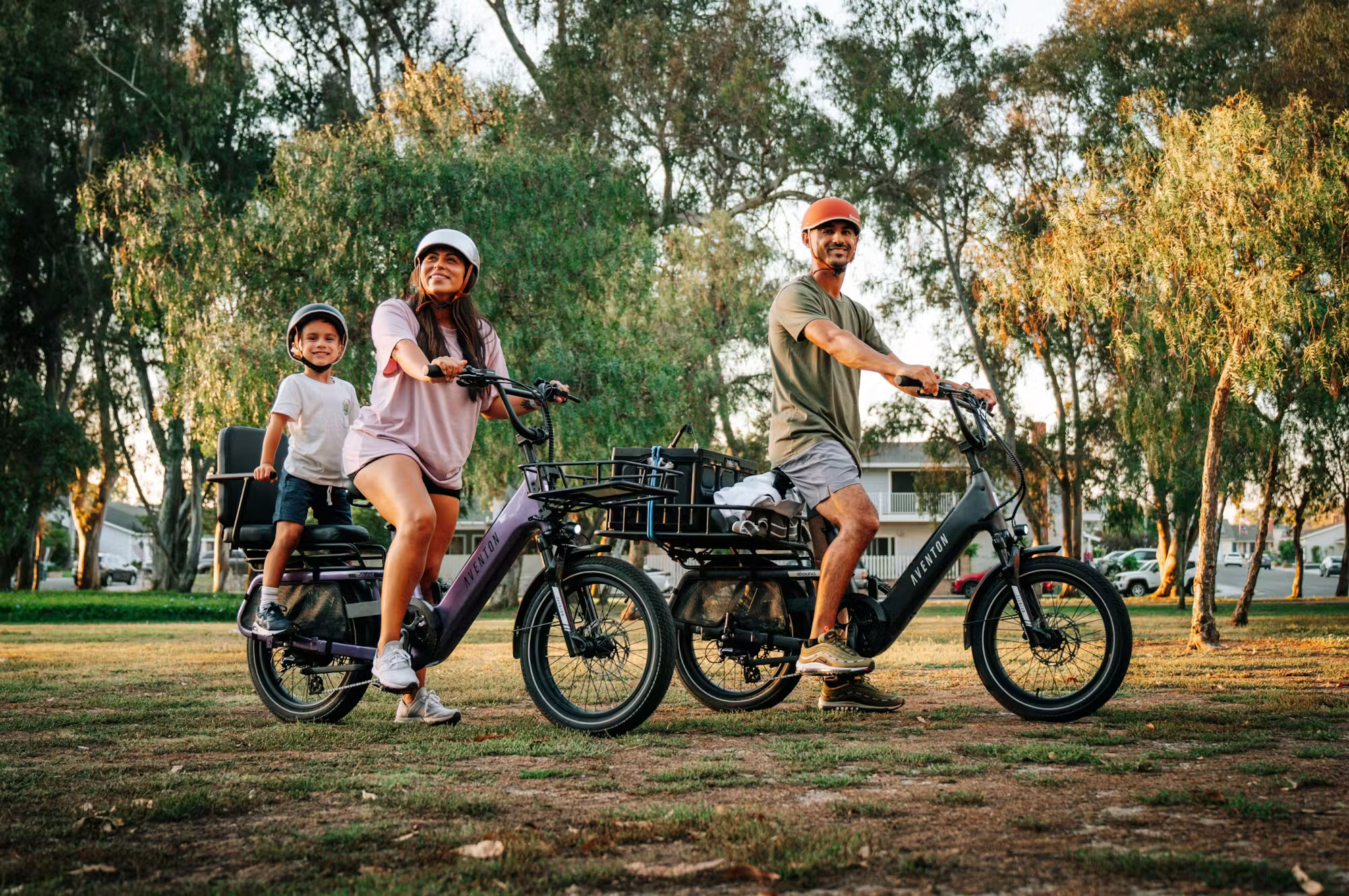 Rex E-Bikes Aventon Abound SR Cargo E-Bike with sturdy frame, cargo rack, and electric assist motor, parked on a city street.