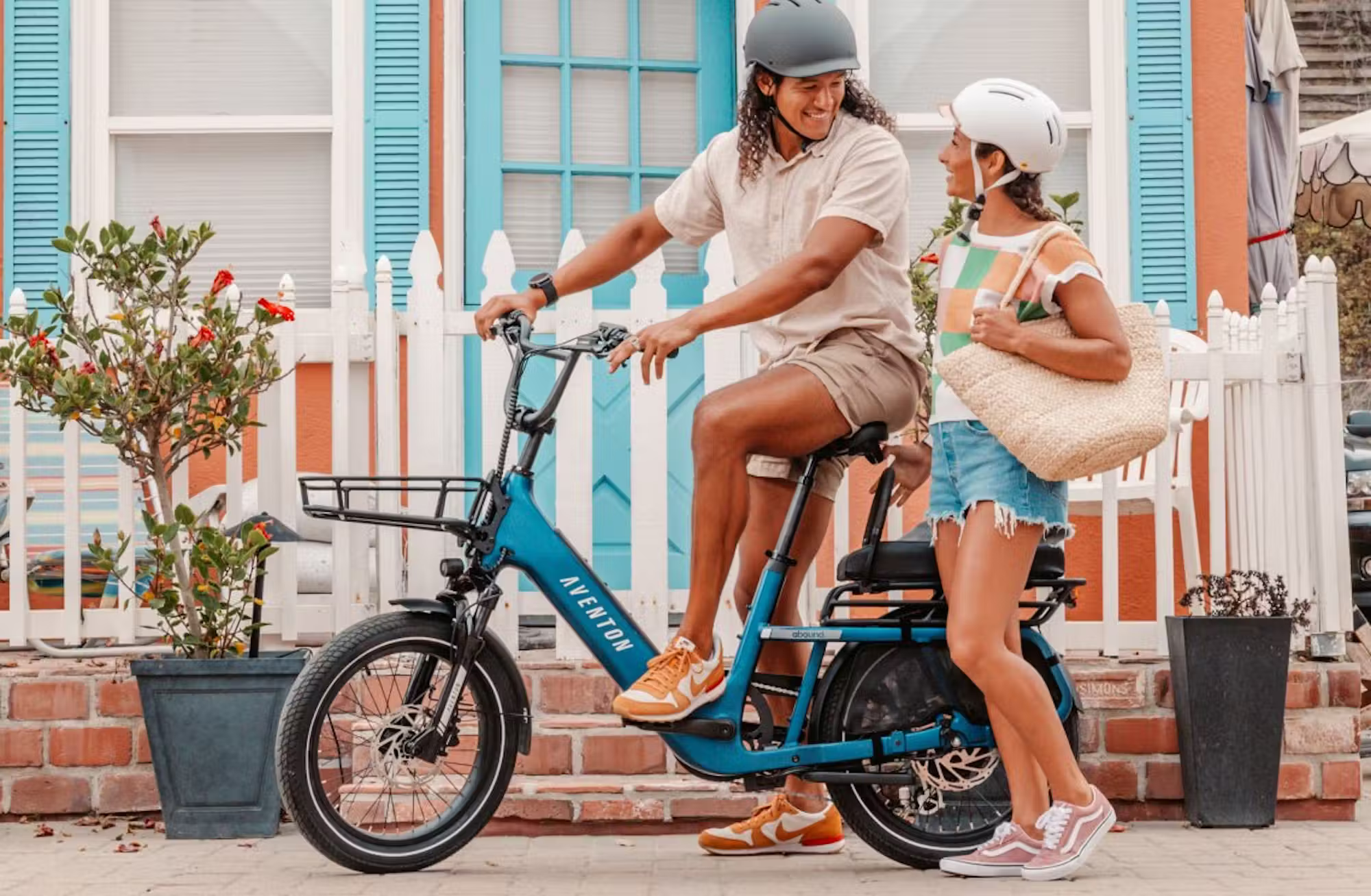Rex E-Bikes Aventon Abound SR Cargo E-Bike with sturdy frame, cargo rack, and electric motor for urban commuting and hauling.