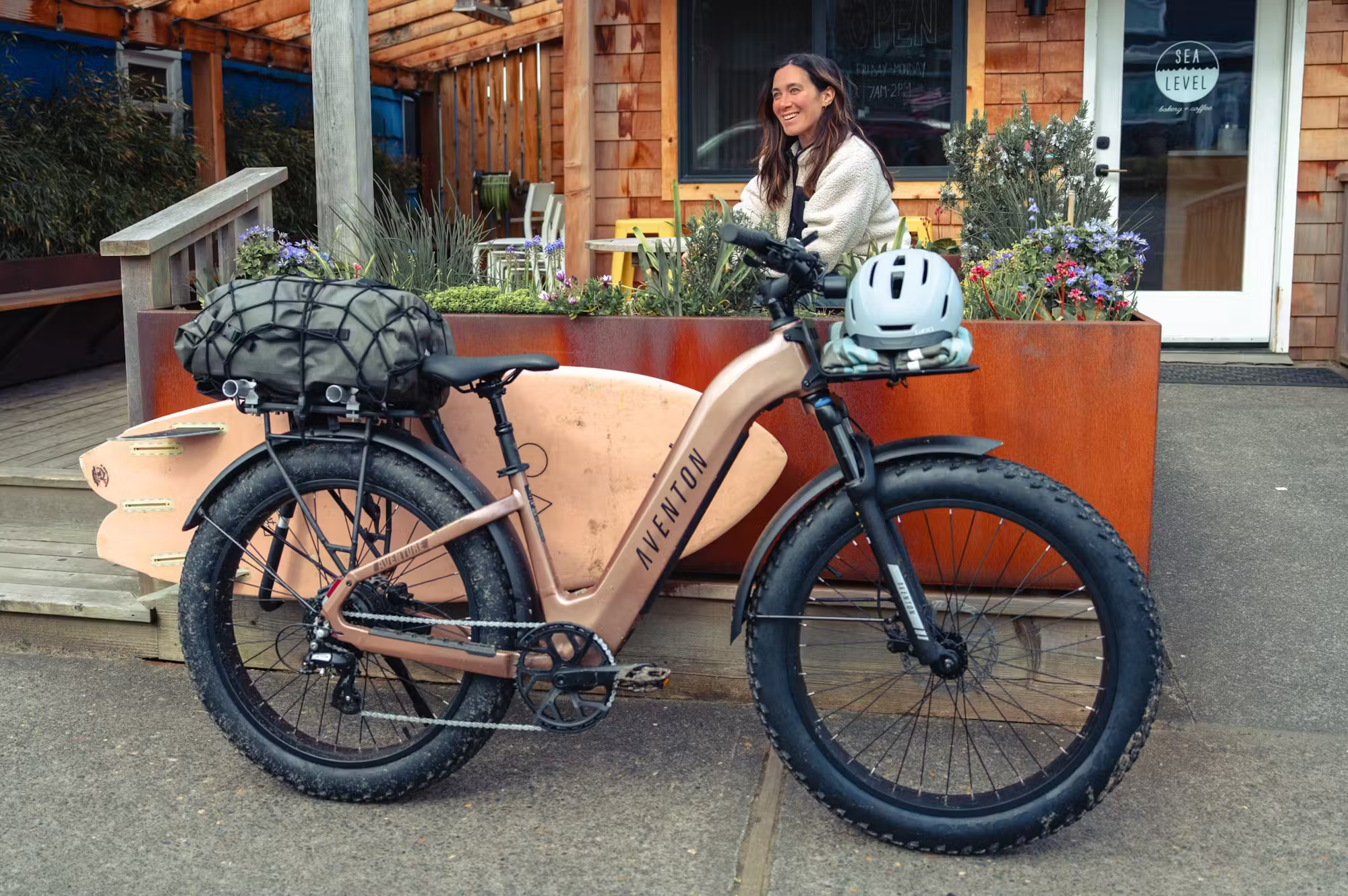 Rex E-Bikes Aventon Aventure.3 E-Bike step-through frame with battery and handlebar controls, ideal for comfortable urban riding.