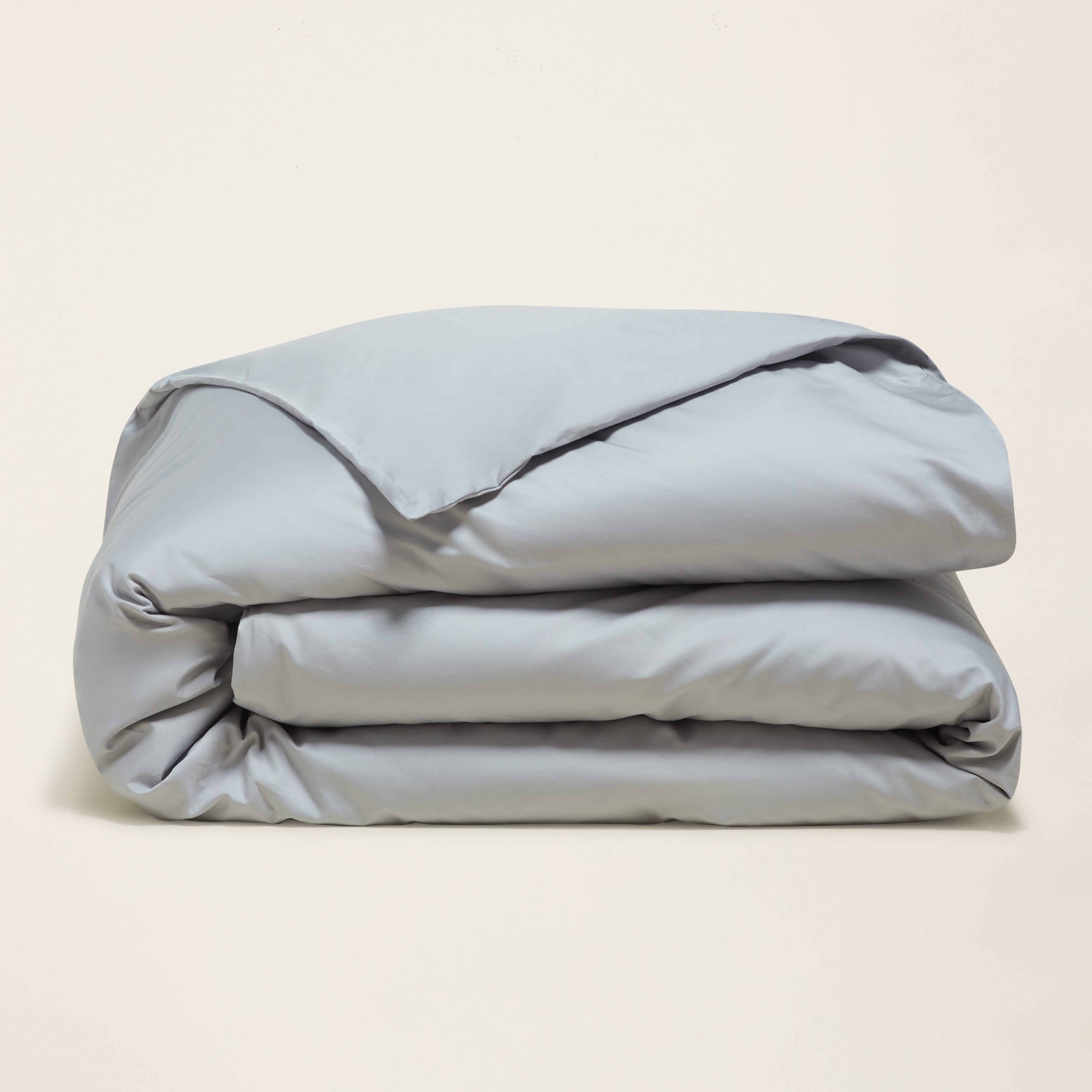 Luxe Australian sateen duvet cover by Italic in a soft, smooth bed with plush pillows, showcasing elegant bedding texture.
