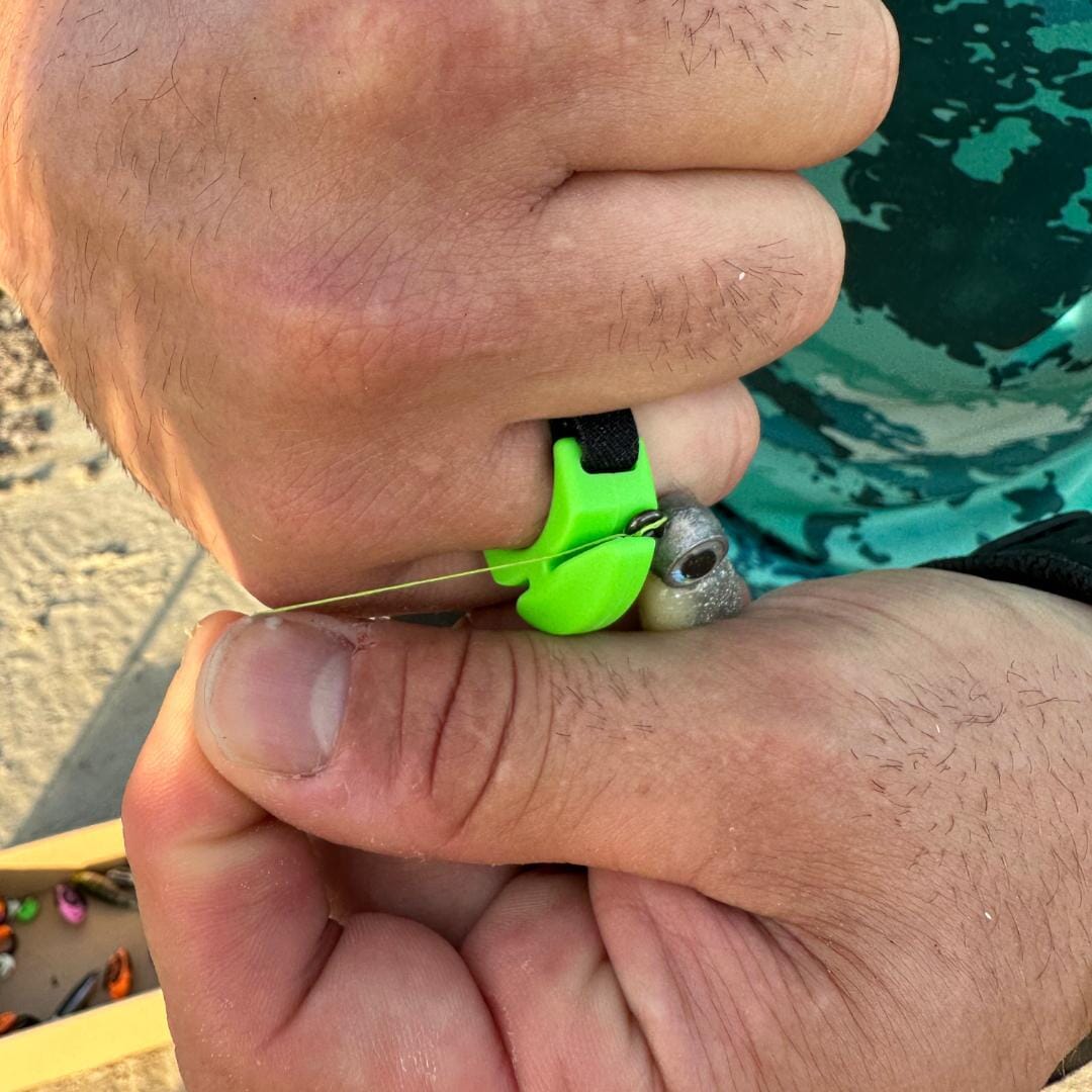 Line Cutterz Ceramic Blade Ring worn on finger, showing durable ceramic blade for cutting and utility purposes.