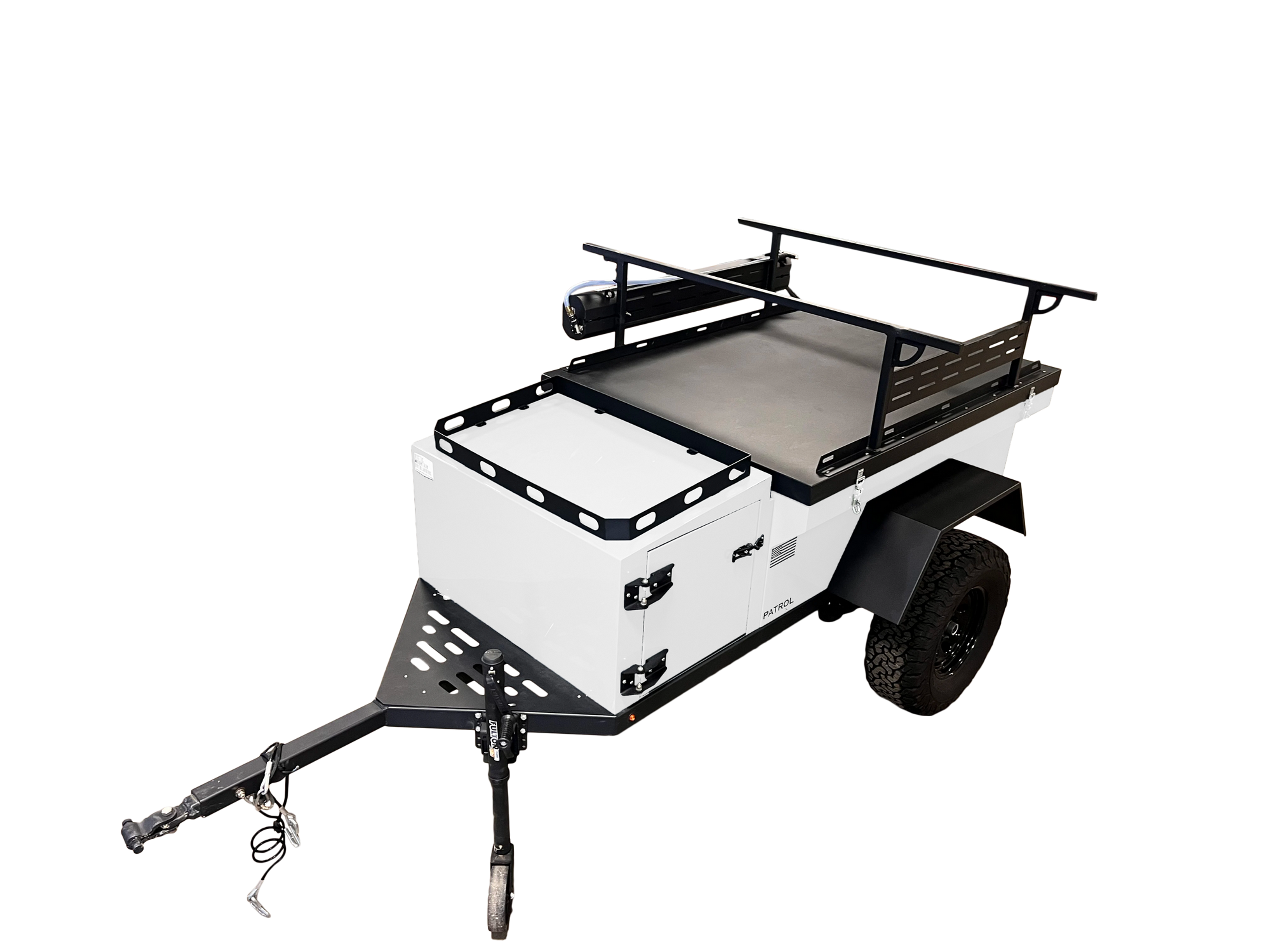 Rustic Mountain Overland PATROL XCT off-road trailer with rugged exterior and off-road tires, designed for overland adventures.