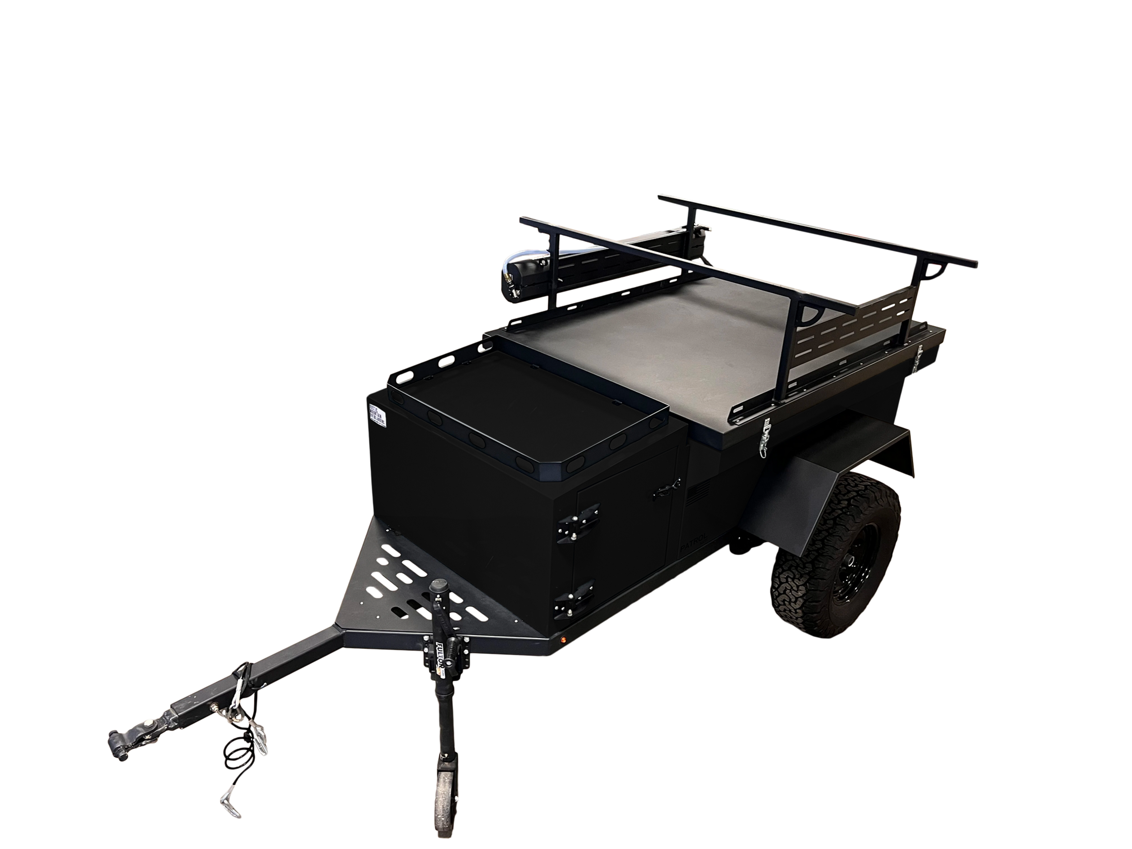 Rustic Mountain Overland PATROL XCT off-road trailer with rugged exterior and off-road tires, designed for overland adventures.