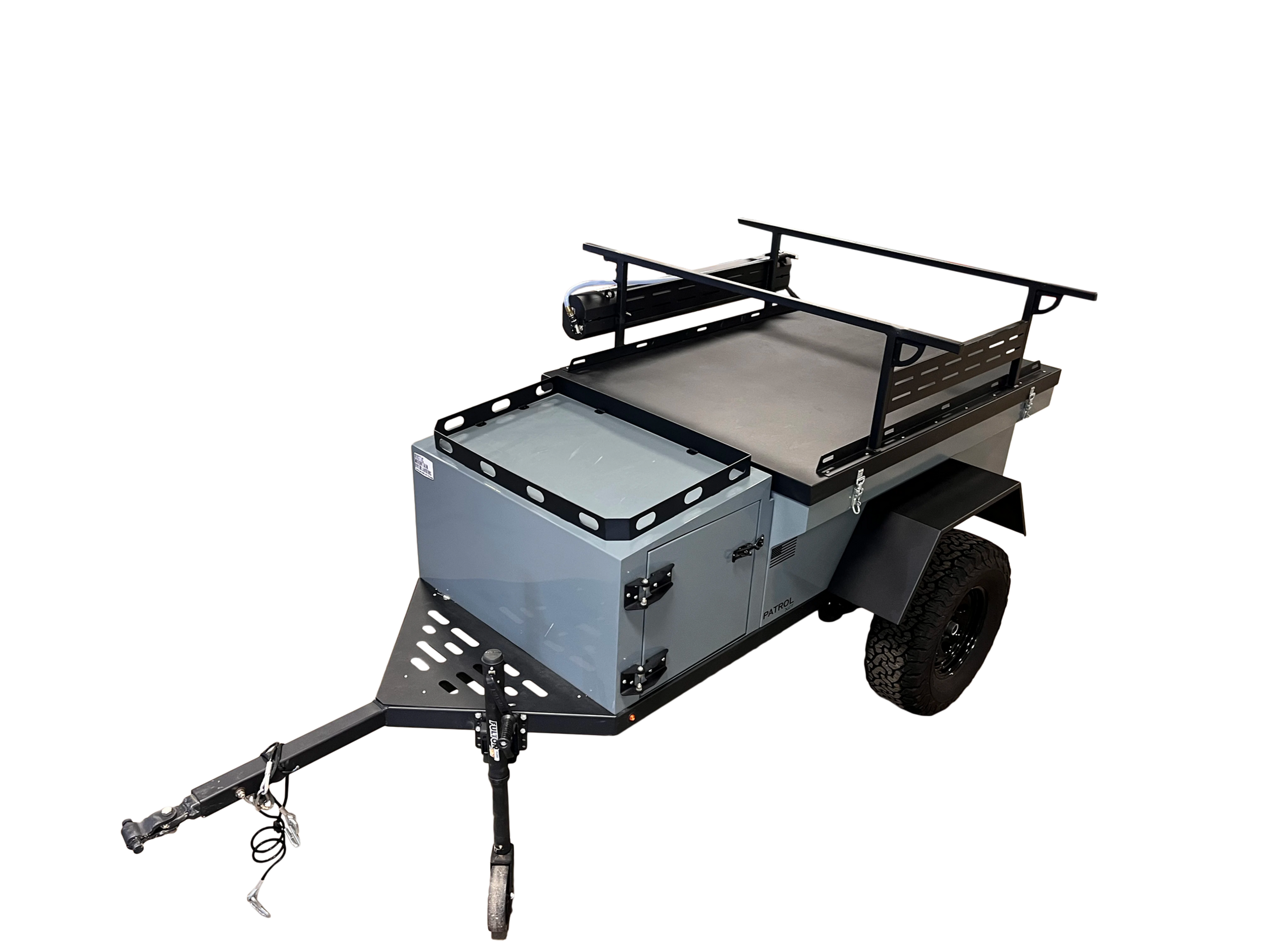 Rustic Mountain Overland PATROL XCT off-road trailer with rugged exterior and off-road tires, designed for overland adventures.
