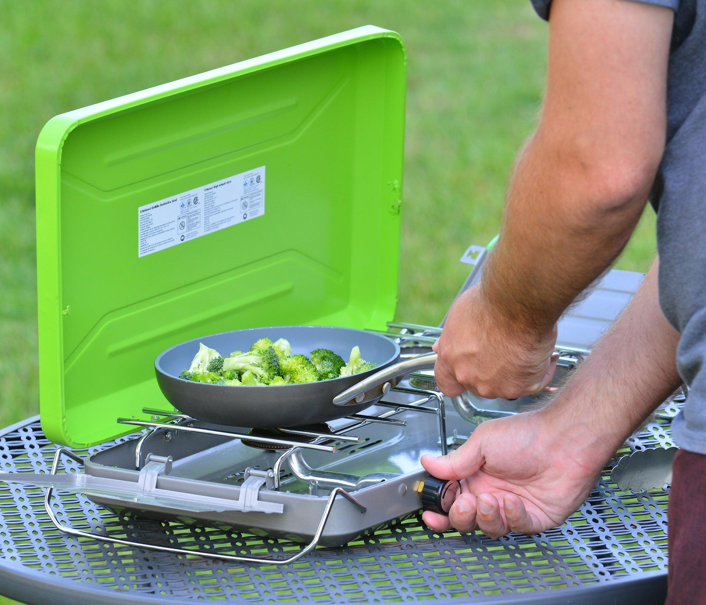 Flame King 2 burner portable propane gas camping stove grill with sturdy legs and dual burners for outdoor cooking.