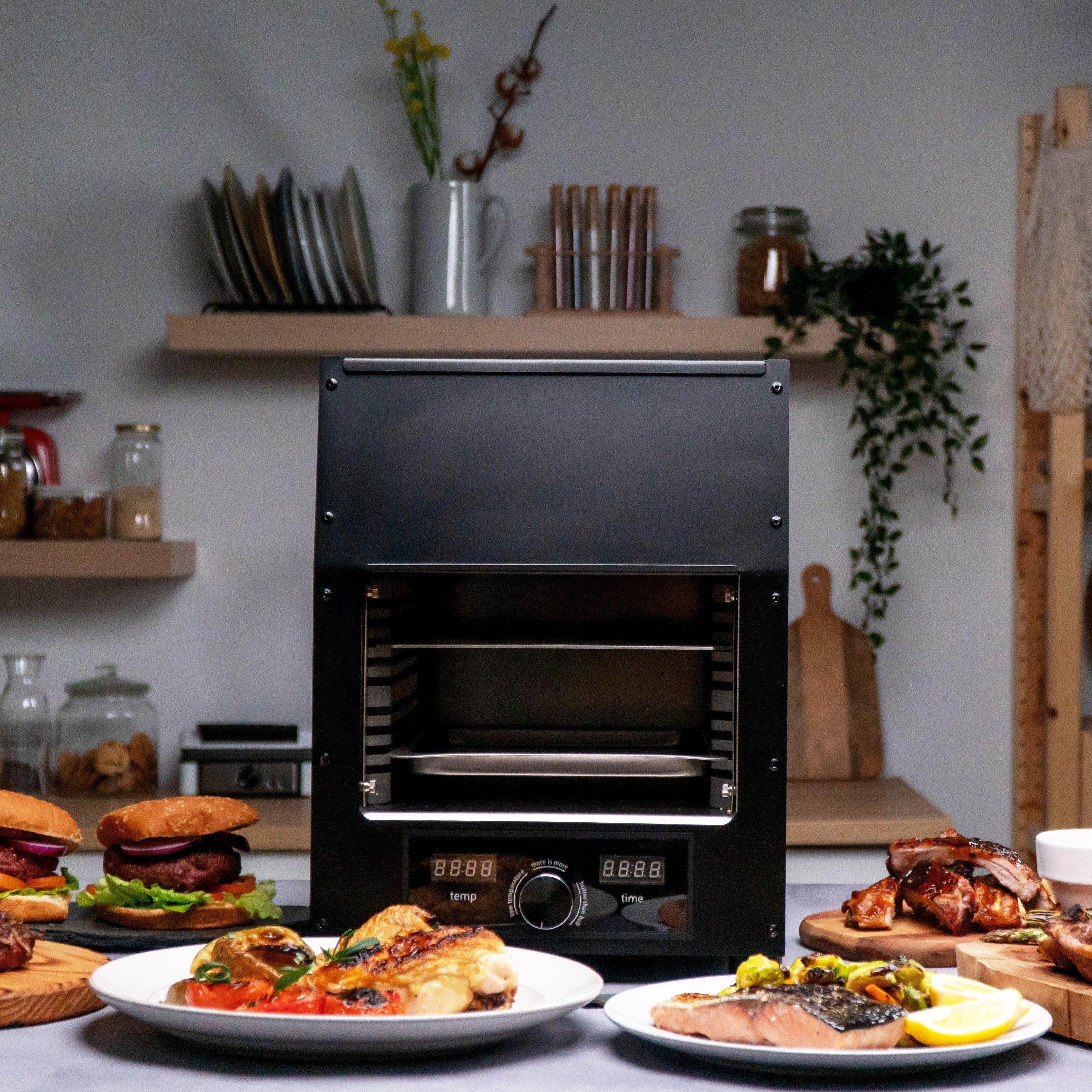 Flame King Electric Rapid Scorch Grill Cooker Oven with a sleek design and cooking surface visible in the image.