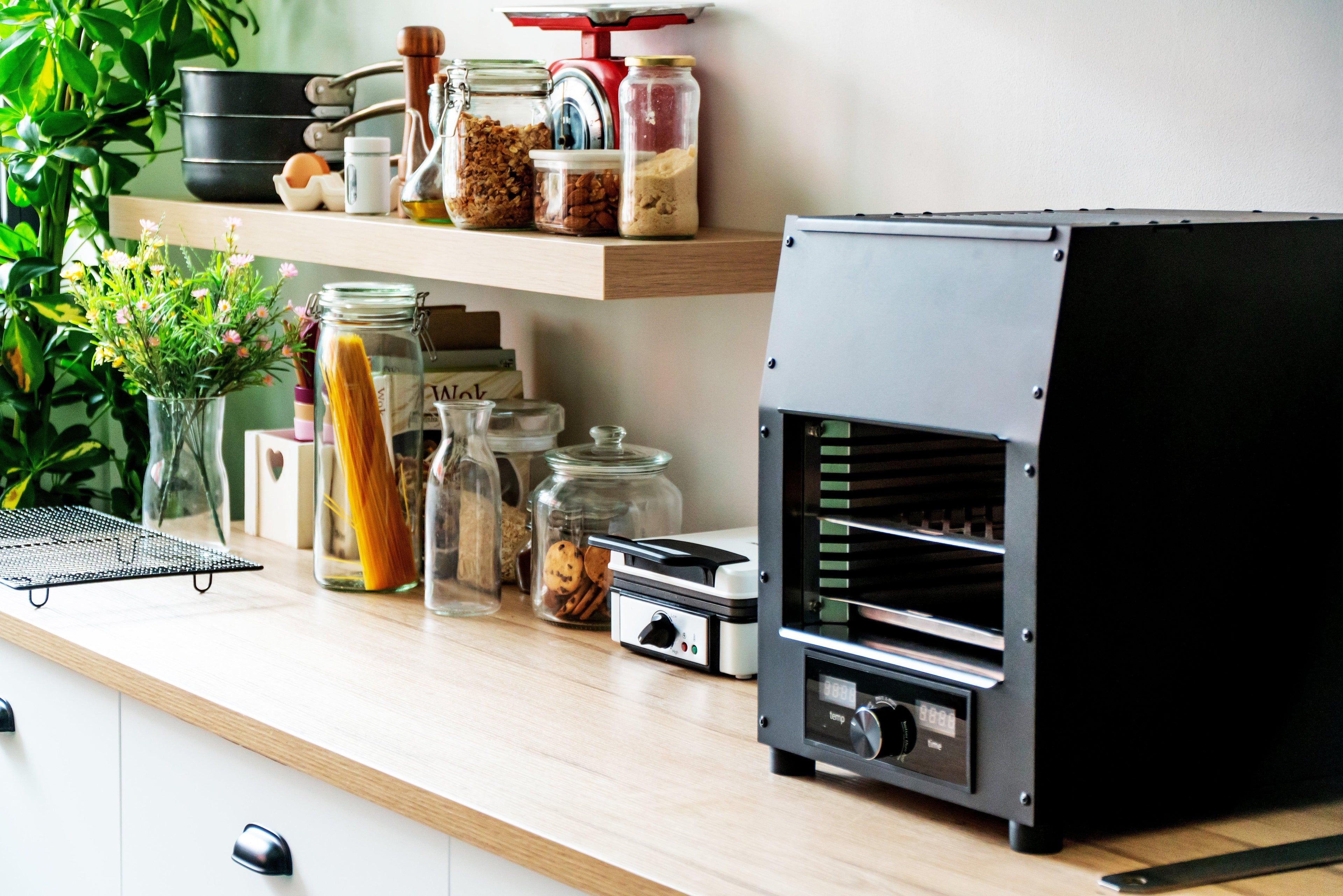 Flame King Electric Rapid Scorch Grill Cooker Oven with sleek design and grilling surface, ideal for outdoor cooking.