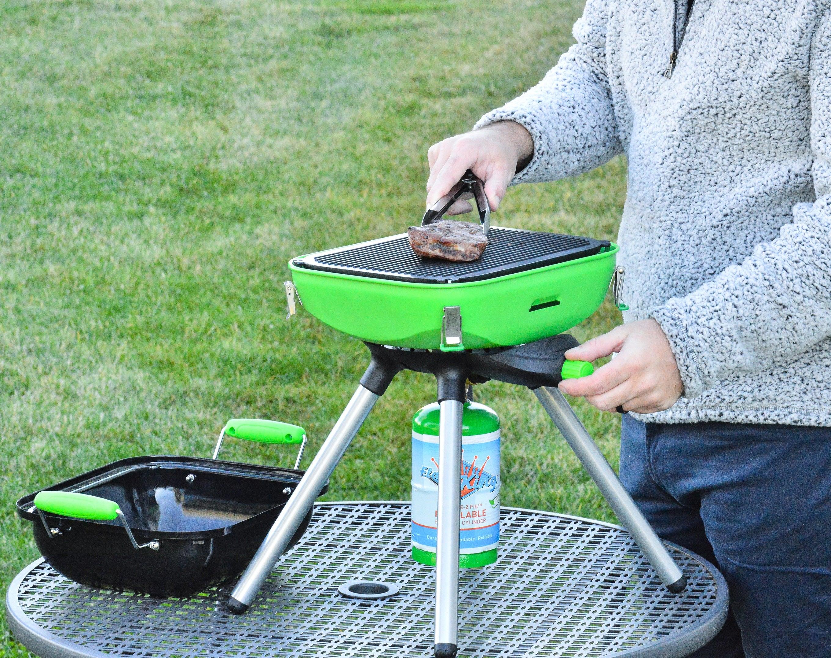 Flame King portable multi-function camping BBQ grill and camp stove with black and silver finish for outdoor cooking.