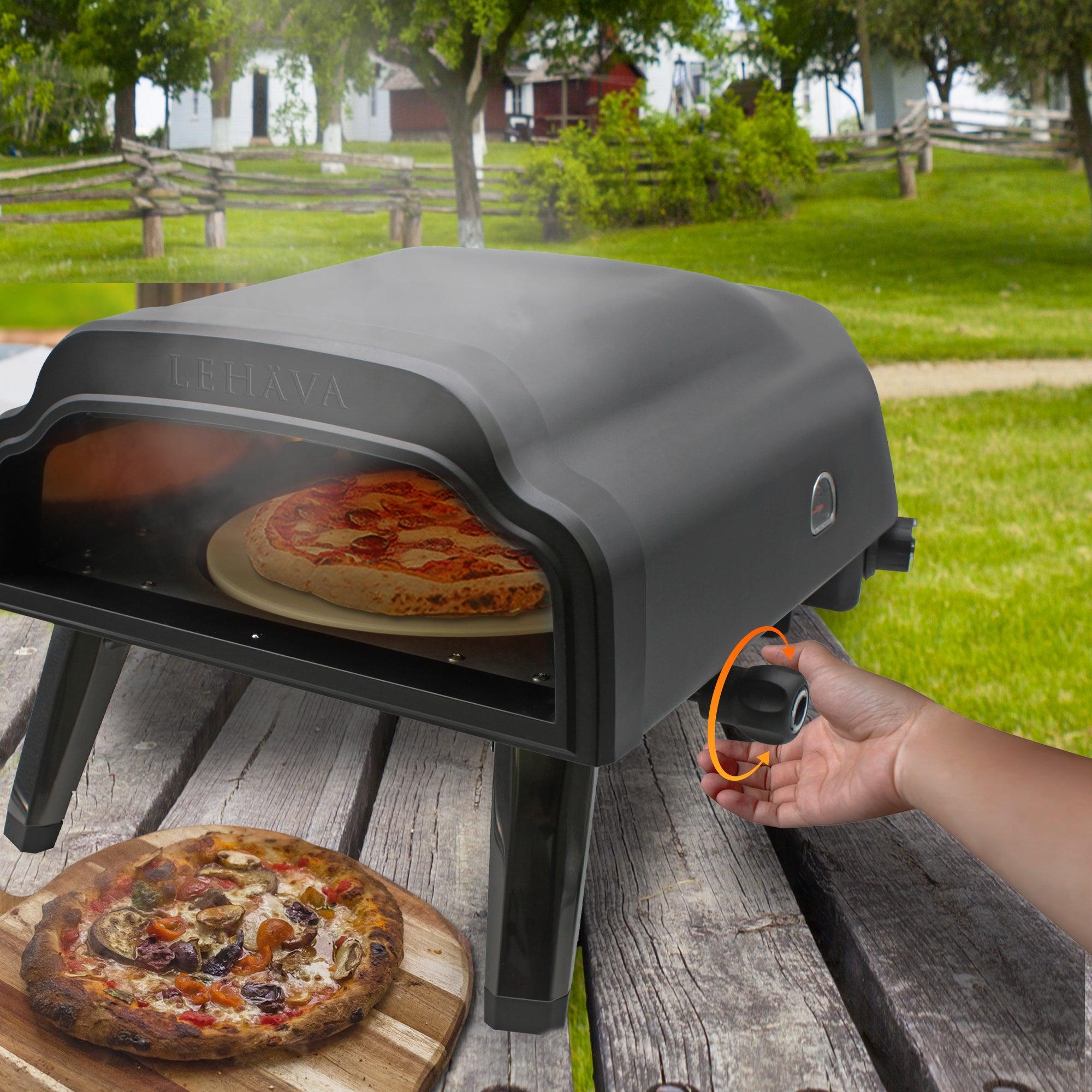 Flame King 14-inch propane pizza oven with rotating stone, designed for outdoor grilling and cooking.