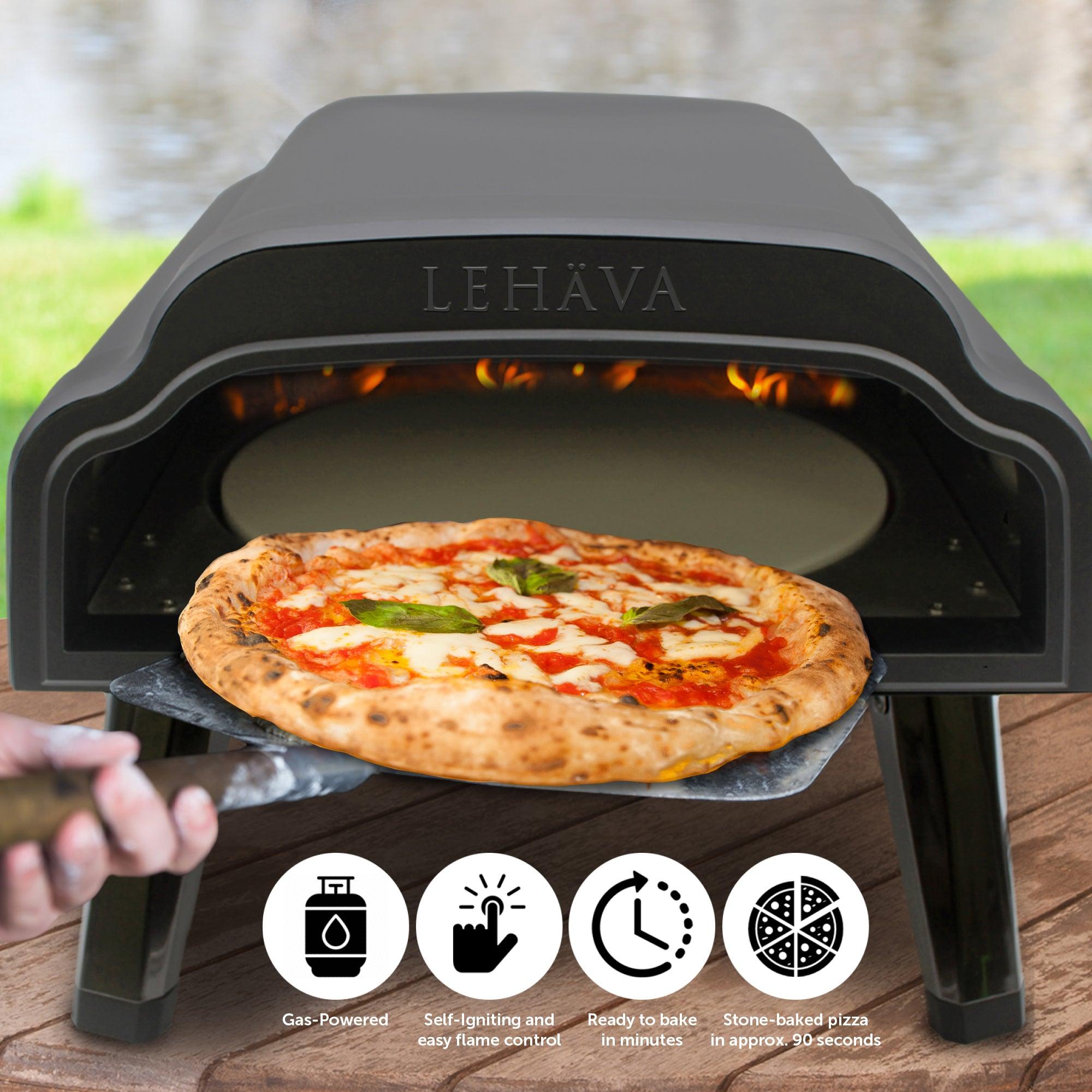 Flame King 14-inch outdoor propane pizza oven with rotating stone, showcasing its compact design and grilling capabilities.