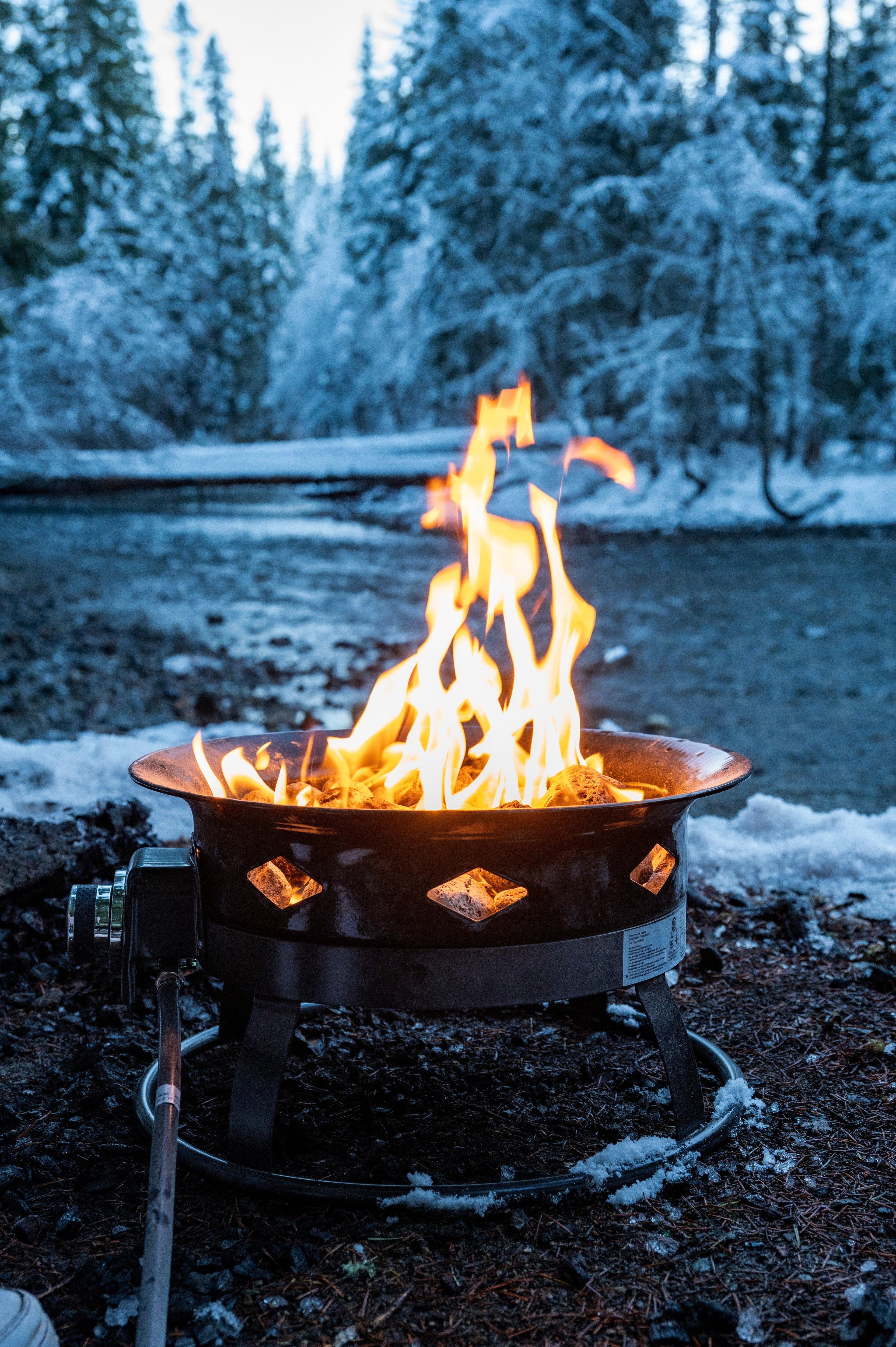 Flame King outdoor portable propane fire pit bowl with self-igniter cover and carry straps, ideal for home and garden use.