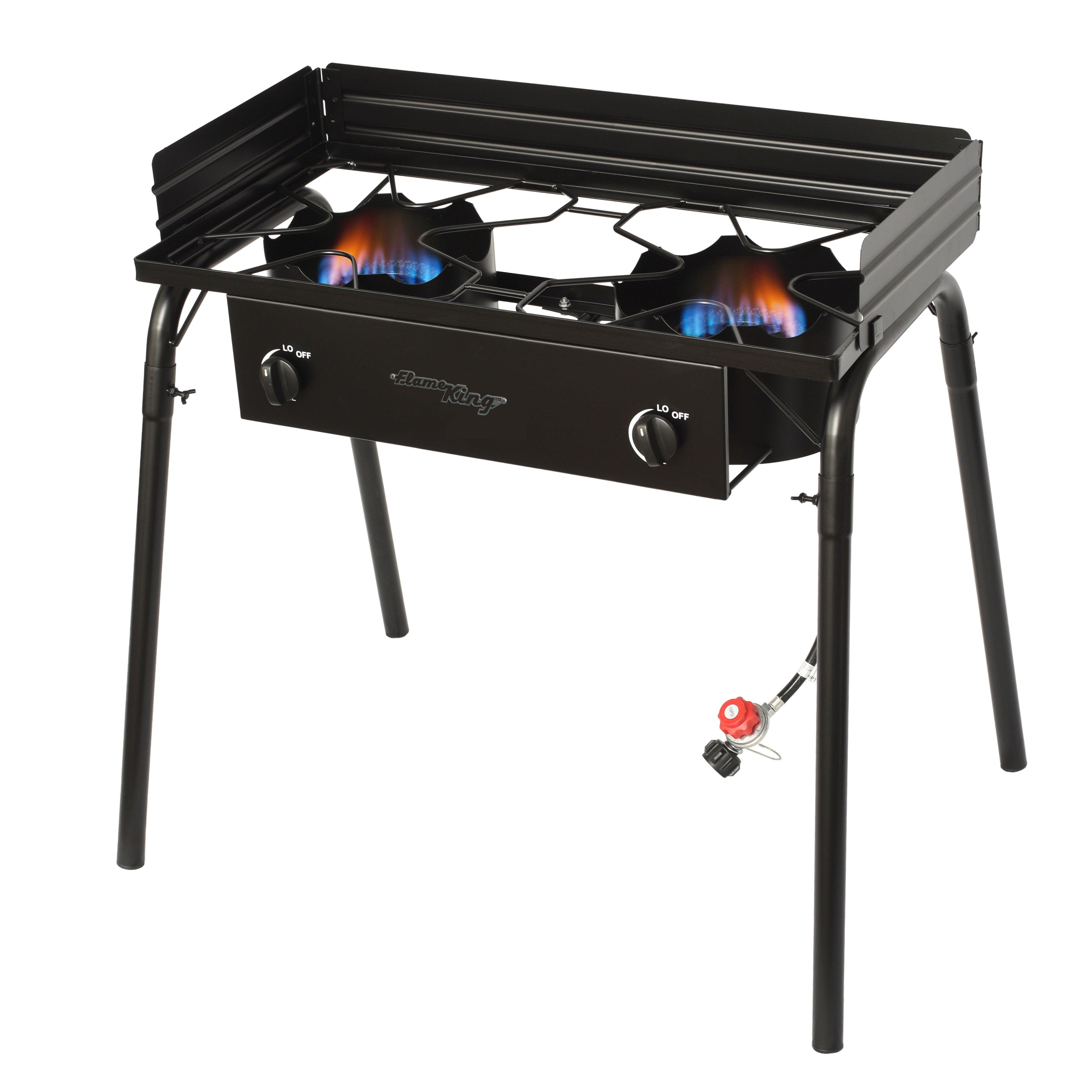 Outdoor Flame King propane double burner cooker stove for camping, with two large burners and sturdy metal construction.