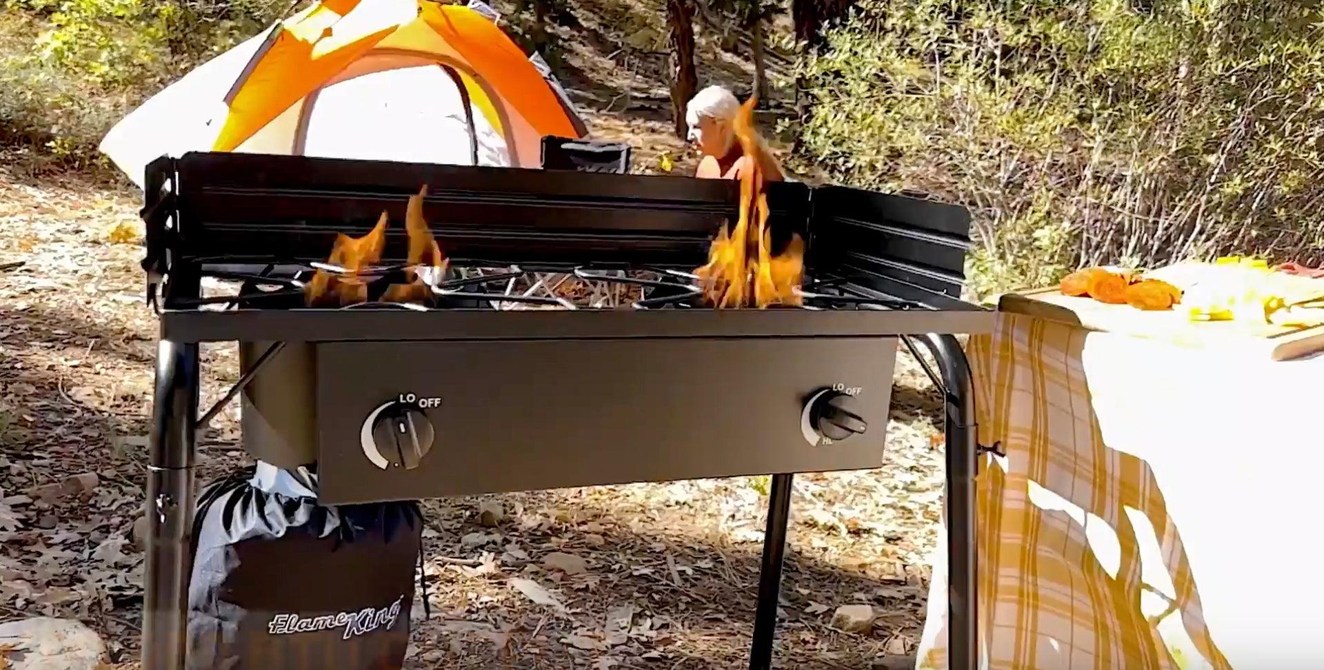 Flame King outdoor propane double burner cooker stove for camping, featuring two large burners and durable metal construction.