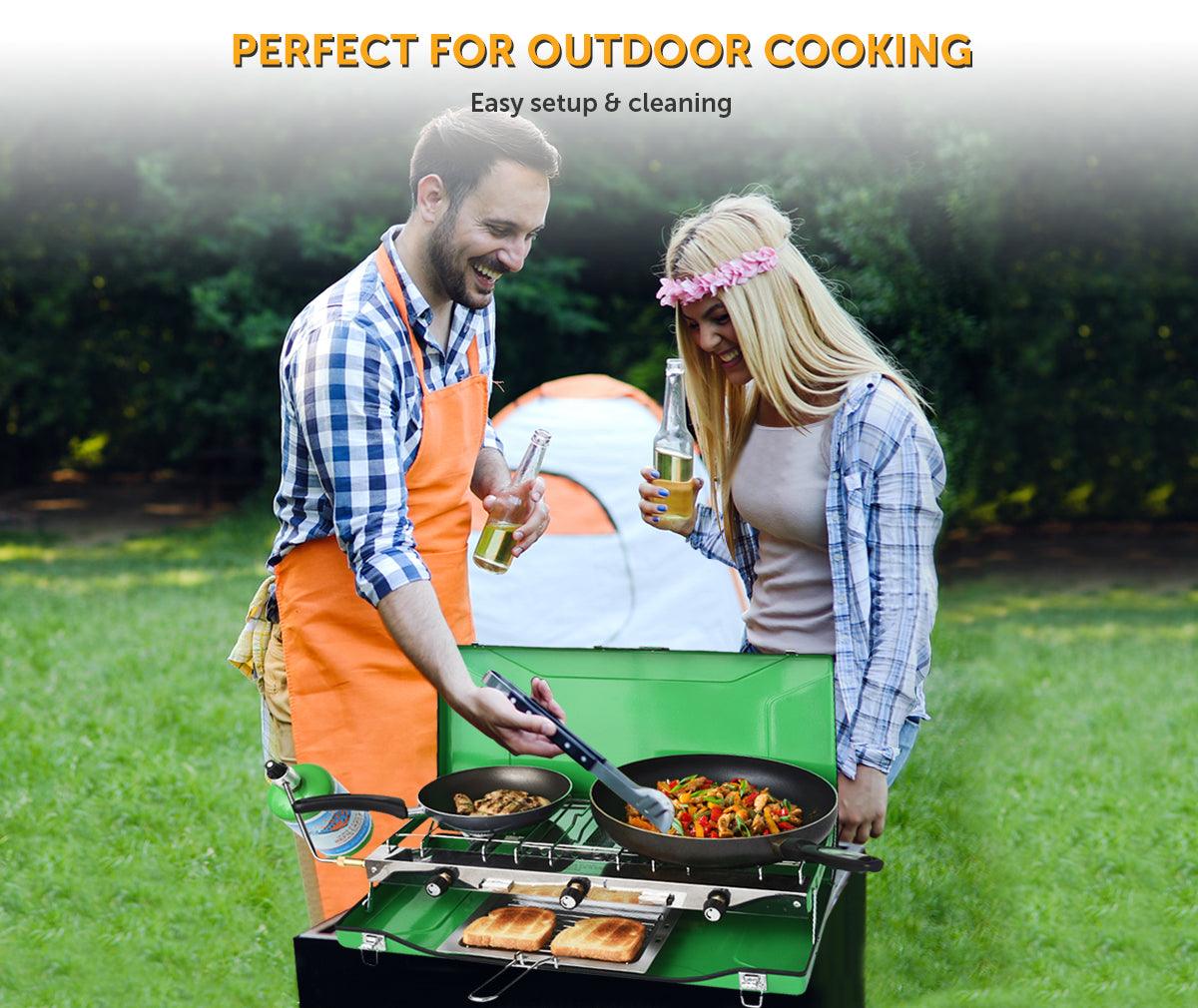 Flame King portable 3-burner propane gas camping stove with toast tray in outdoor setting.